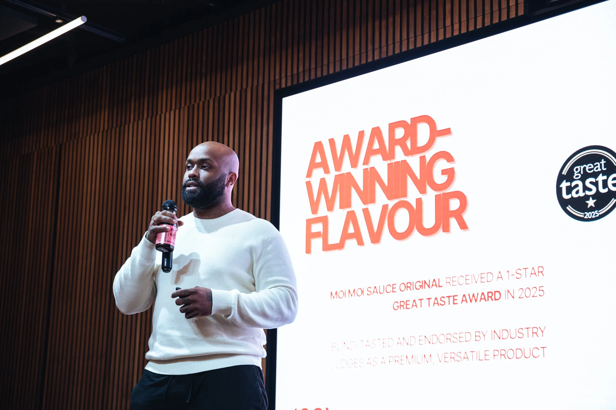 A business owner pitching in front of the judges