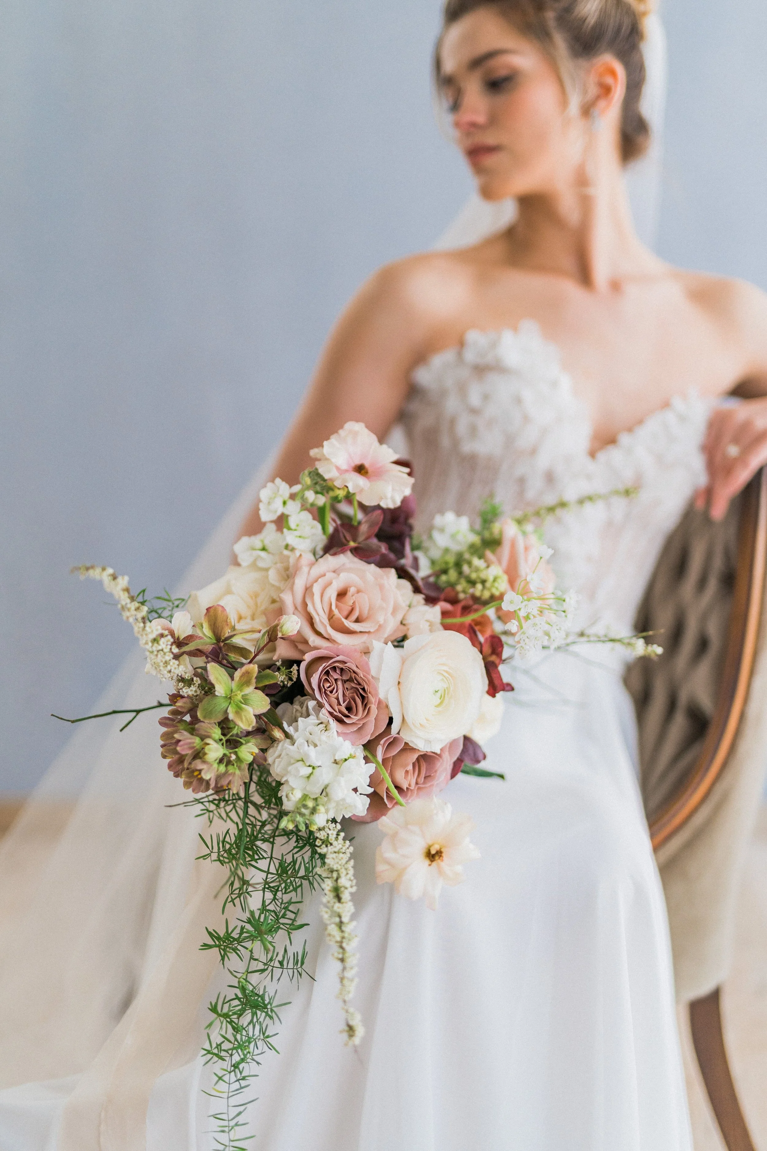A bride holding a Twig & Bloom bridal bouquet in Regina SK