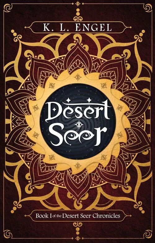 Cover of Desert Seer: Book One of the Desert Seer Chronicles by K. L. Engel, featuring red and yellow patterns. The e's in Seer are designed to look like eyes.