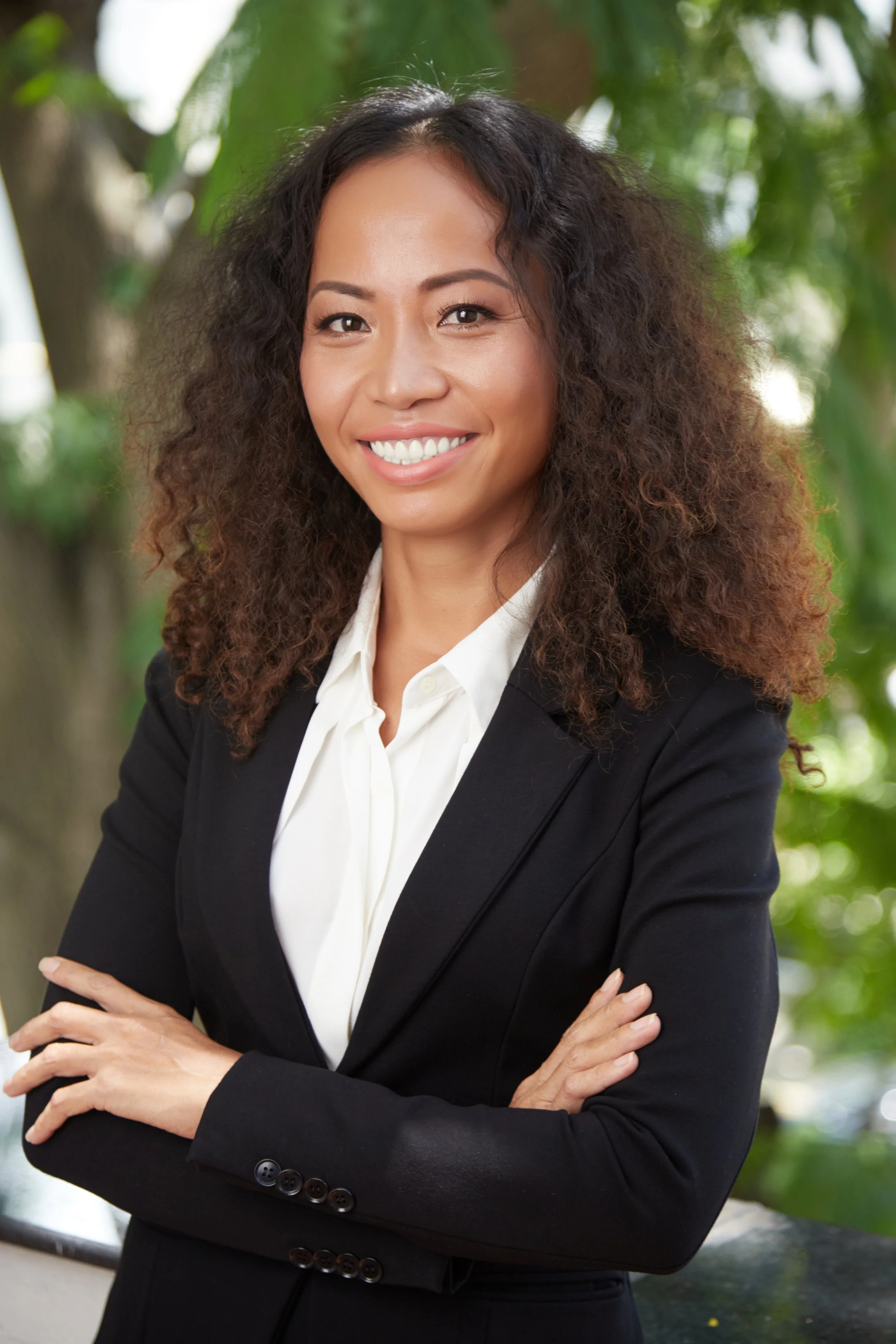 happy-ethnic-executive-woman-looking-camera.jpg