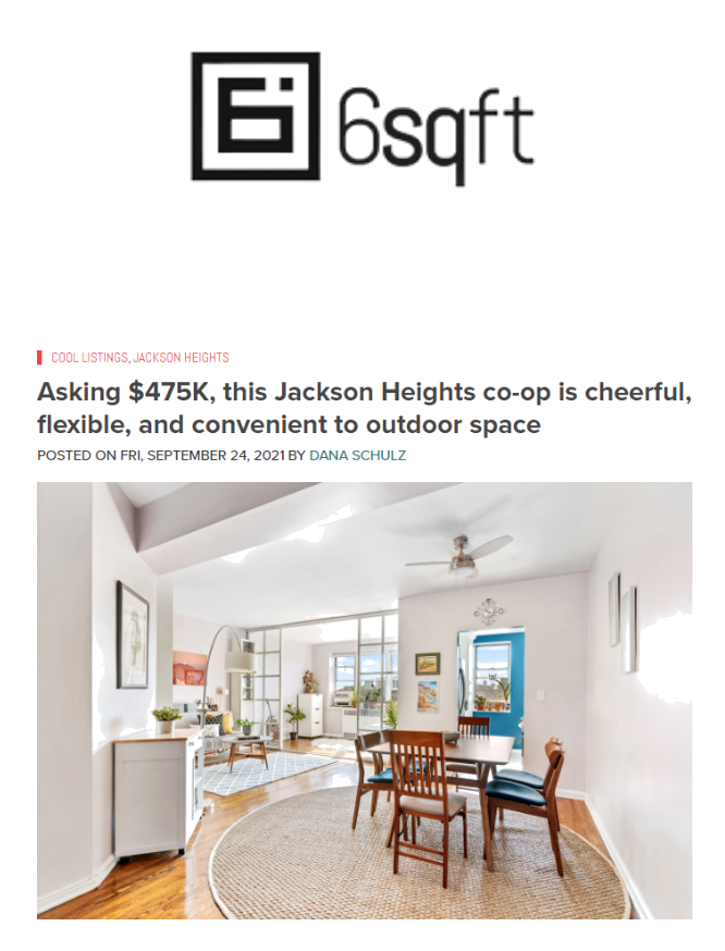 Interior view of a modern dining area with wooden table and chairs, white walls, and large windows, bright and airy