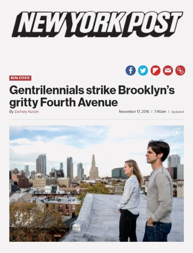 Two young adults, a man and a woman, standing on a rooftop overlooking Brooklyn, New York, with the city skyline in the background, including the Empire State Building and other skyscrapers.