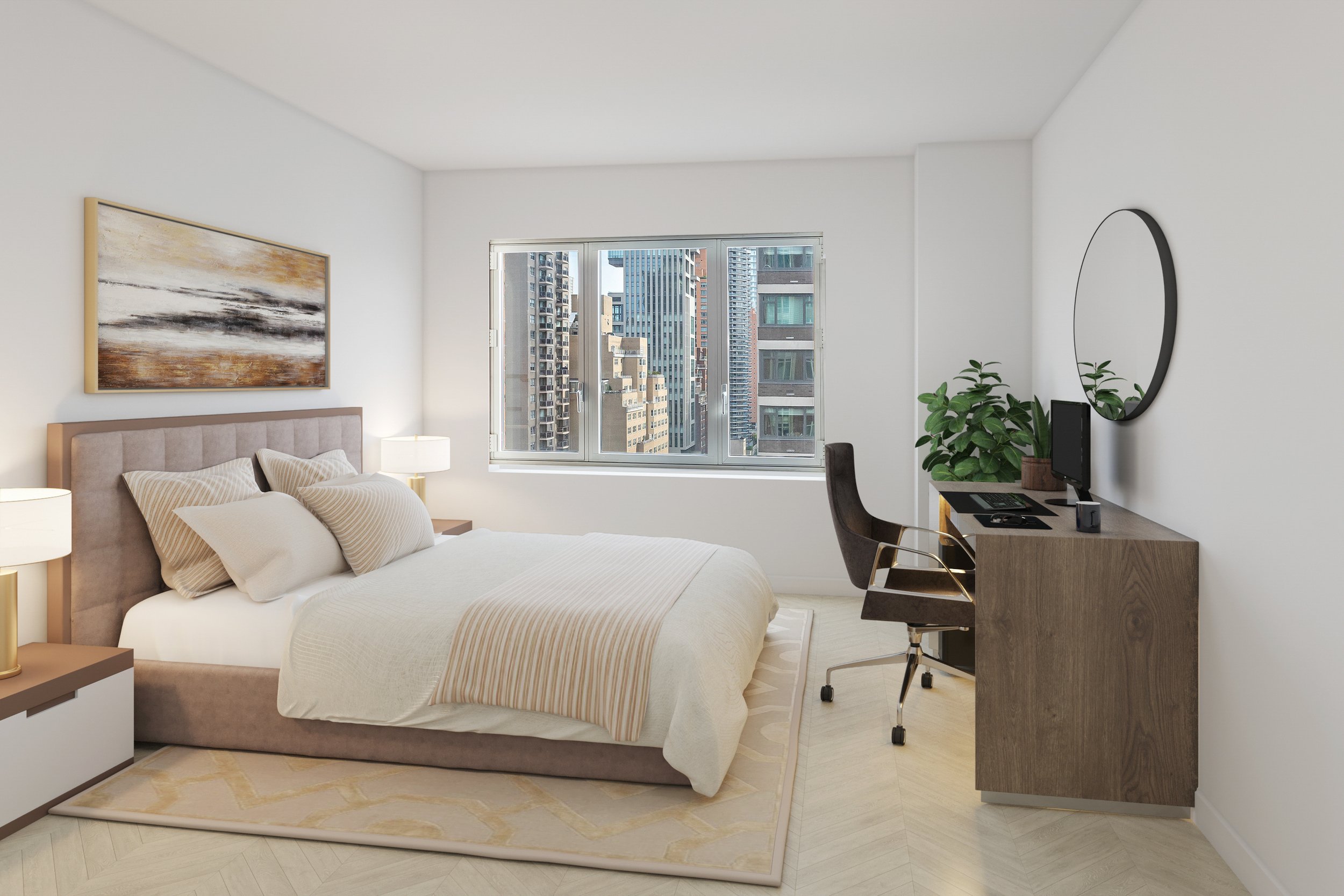 Modern bedroom with beige upholstered bed, six pillows, two bedside lamps, a window with a cityscape view, a wooden desk with a monitor, keyboard, mouse, and potted plant, a black office chair, and a round mirror on the wall.