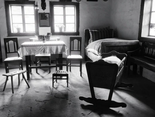 Black and white image of an old simple home