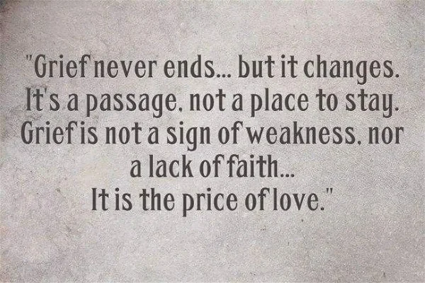 Sign with a message "Grief never ends... It is the price of love"