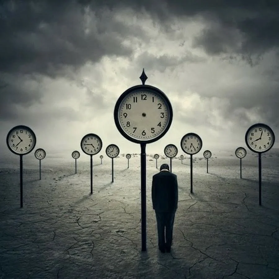 Person standing next to clock on a pole