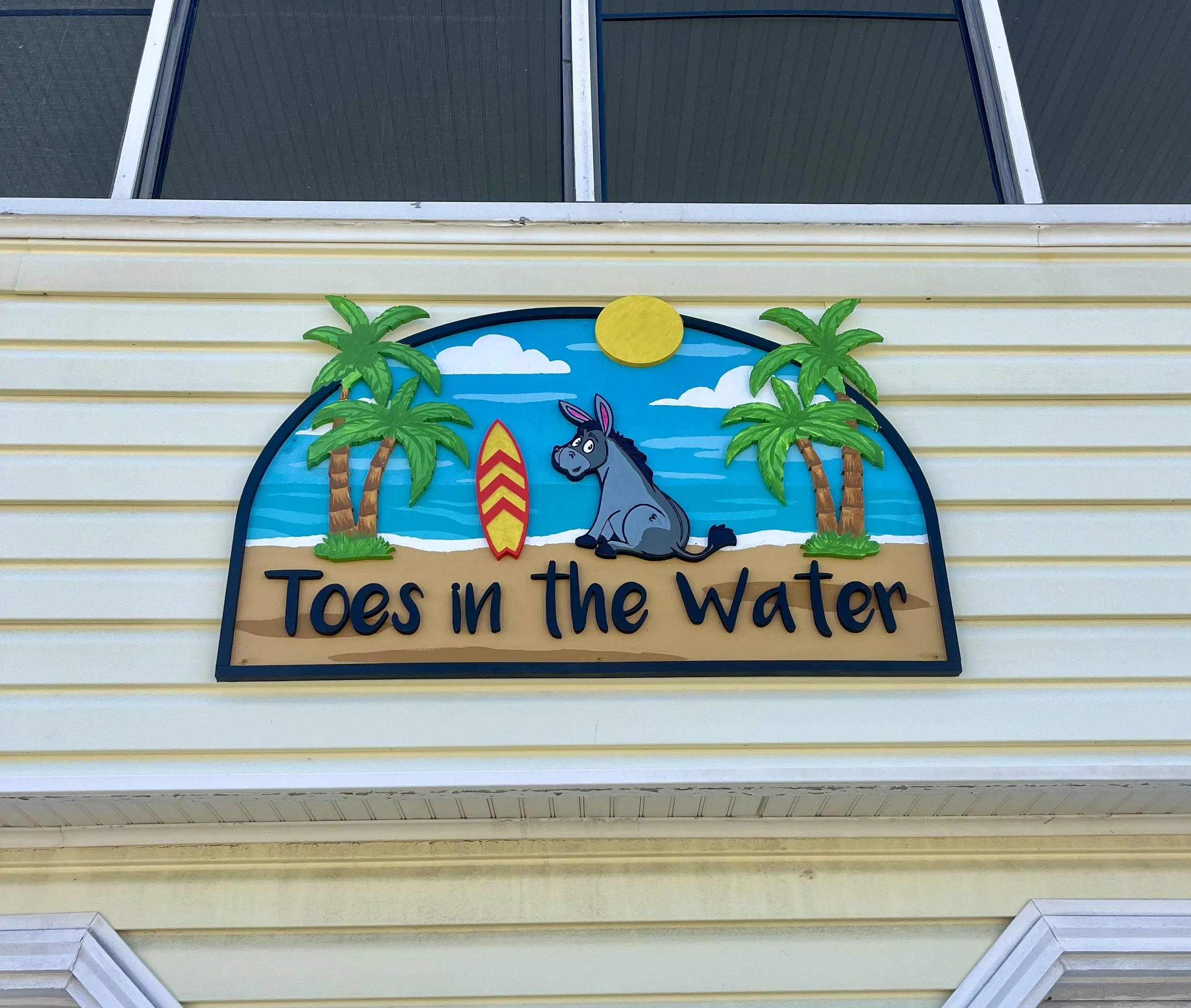toes in the water beach house sign.jpg