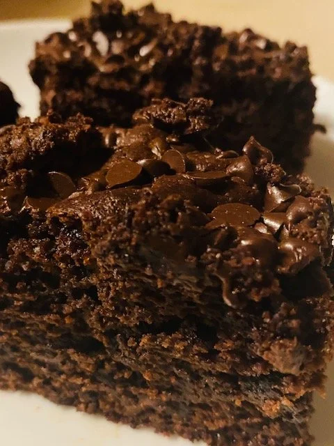 Tall, fudgy triple‑chunk brownies enriched with cream cheese for extra height and moisture. Loaded with milk, dark, and semisweet chocolate in every bite.