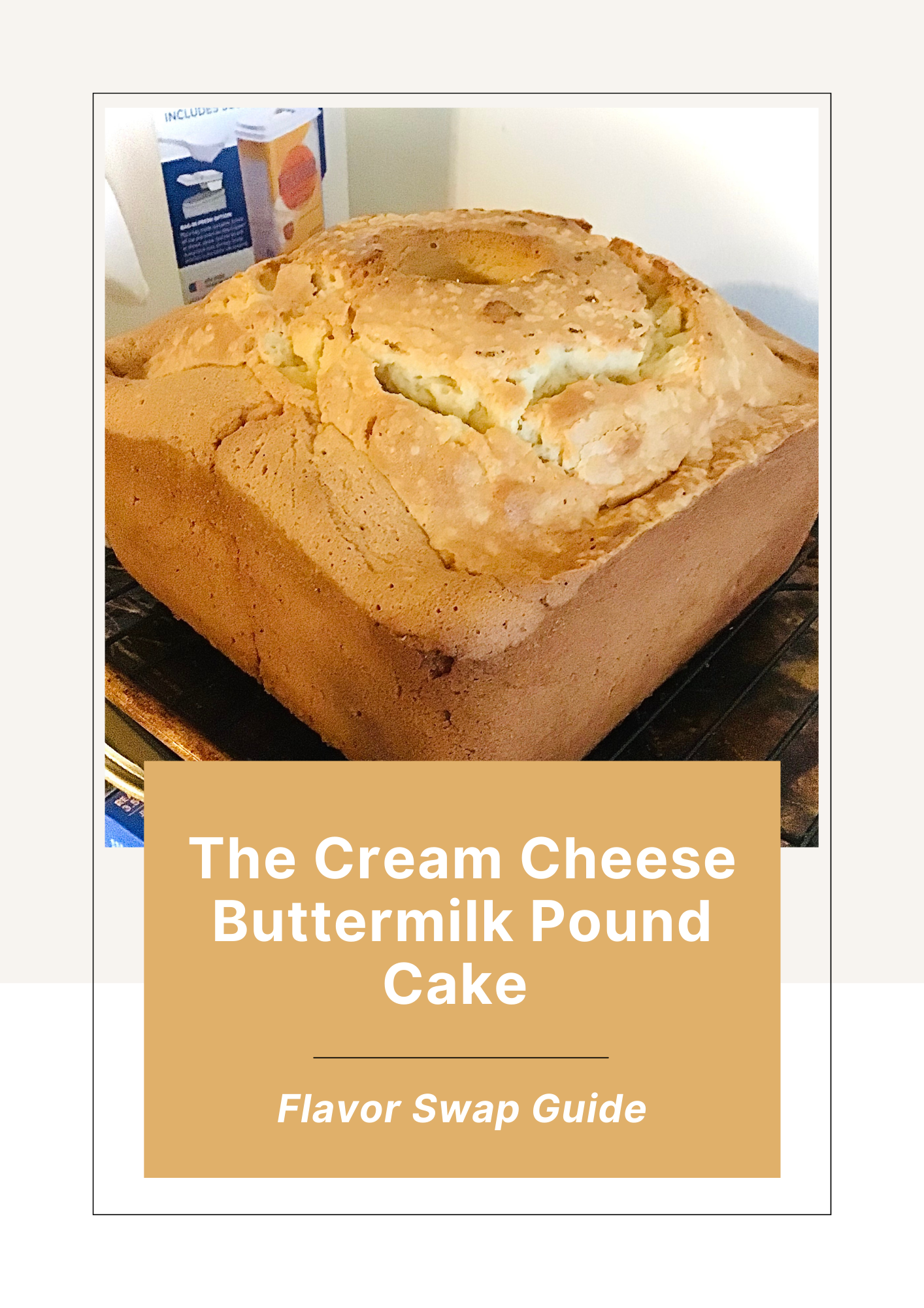 A baking pan containing a freshly baked cream cheese buttermilk pound cake with a golden-brown crust and a cracked top. In the background, there is a box of baking mix visible.