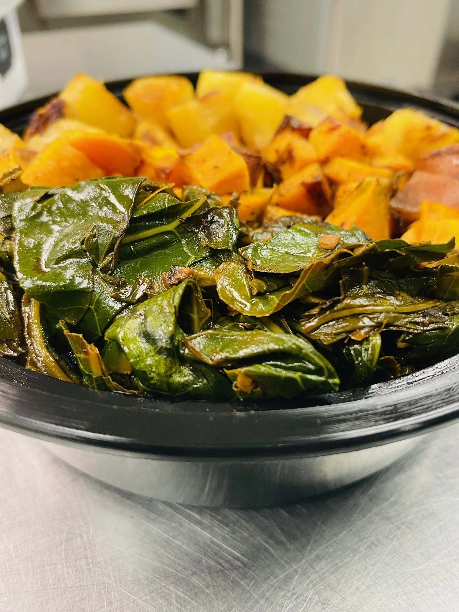 A soul bowl with collard greens, sweet potatoes and rice