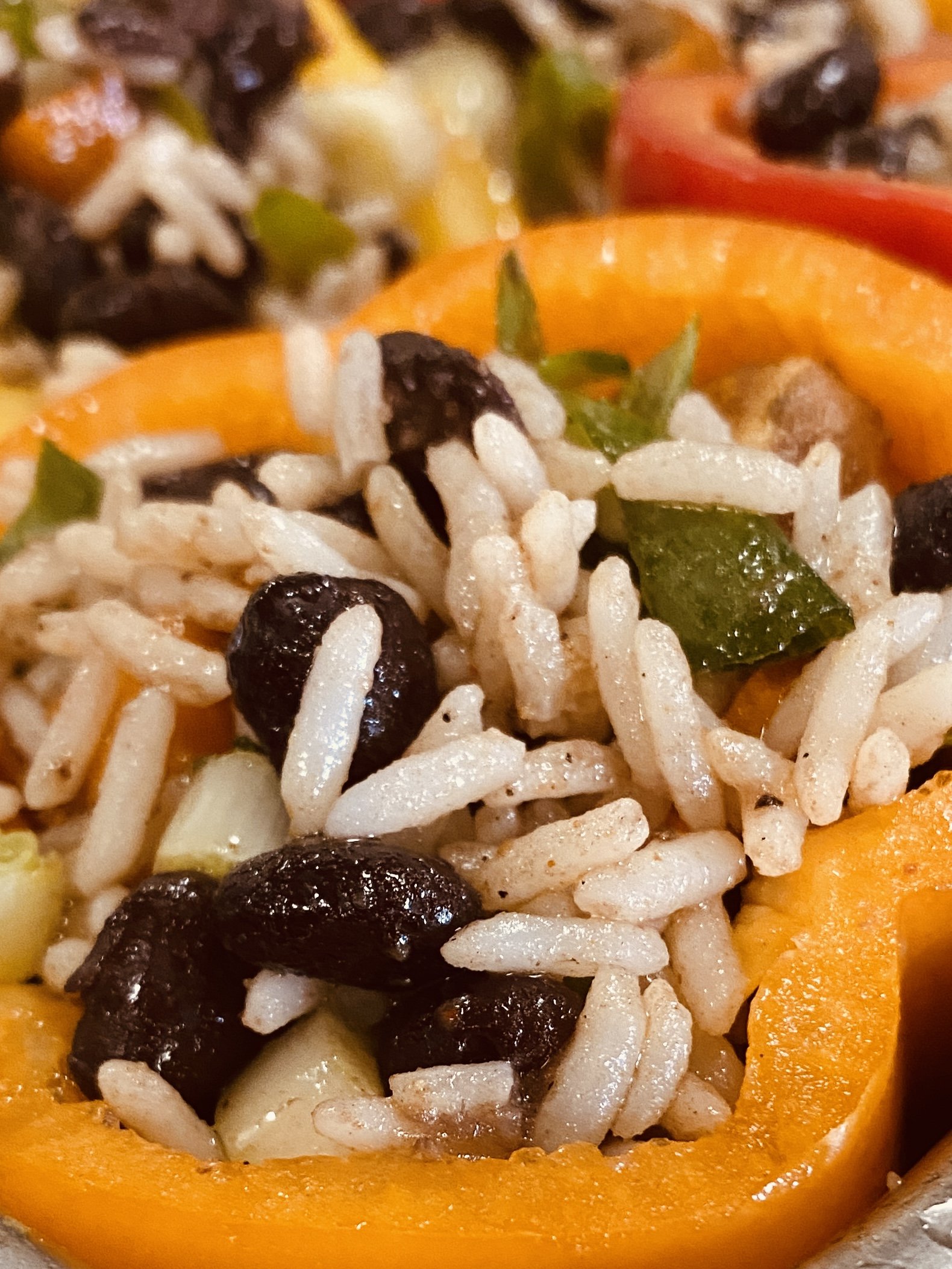 Vegetarian stuffed bell peppers made with rice, sweet potatoes, and black beans. A gluten-free, budget-friendly main dish perfect for church dinners, fundraisers, and feeding a crowd.