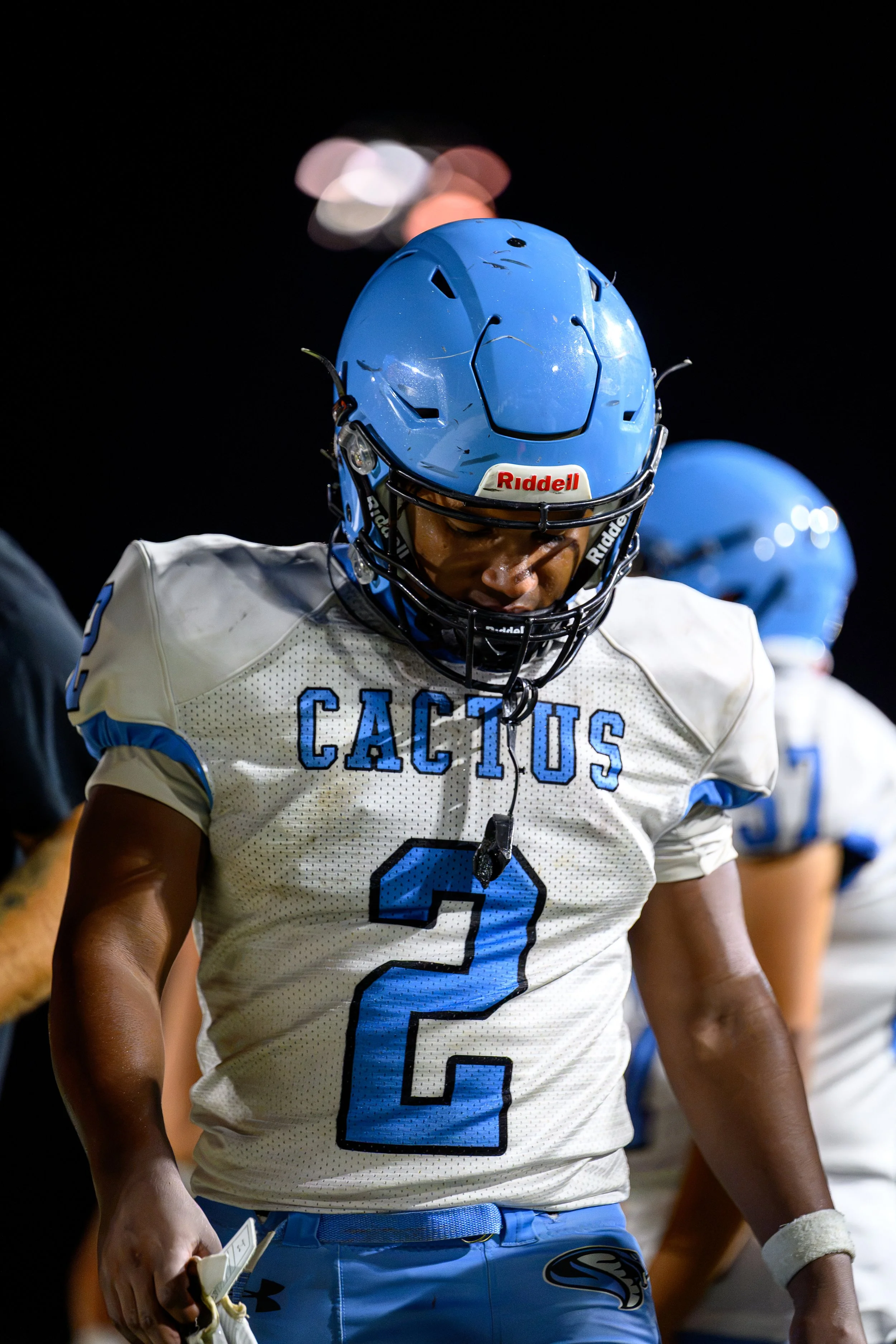 Cactus High School Football player walking on the sideline