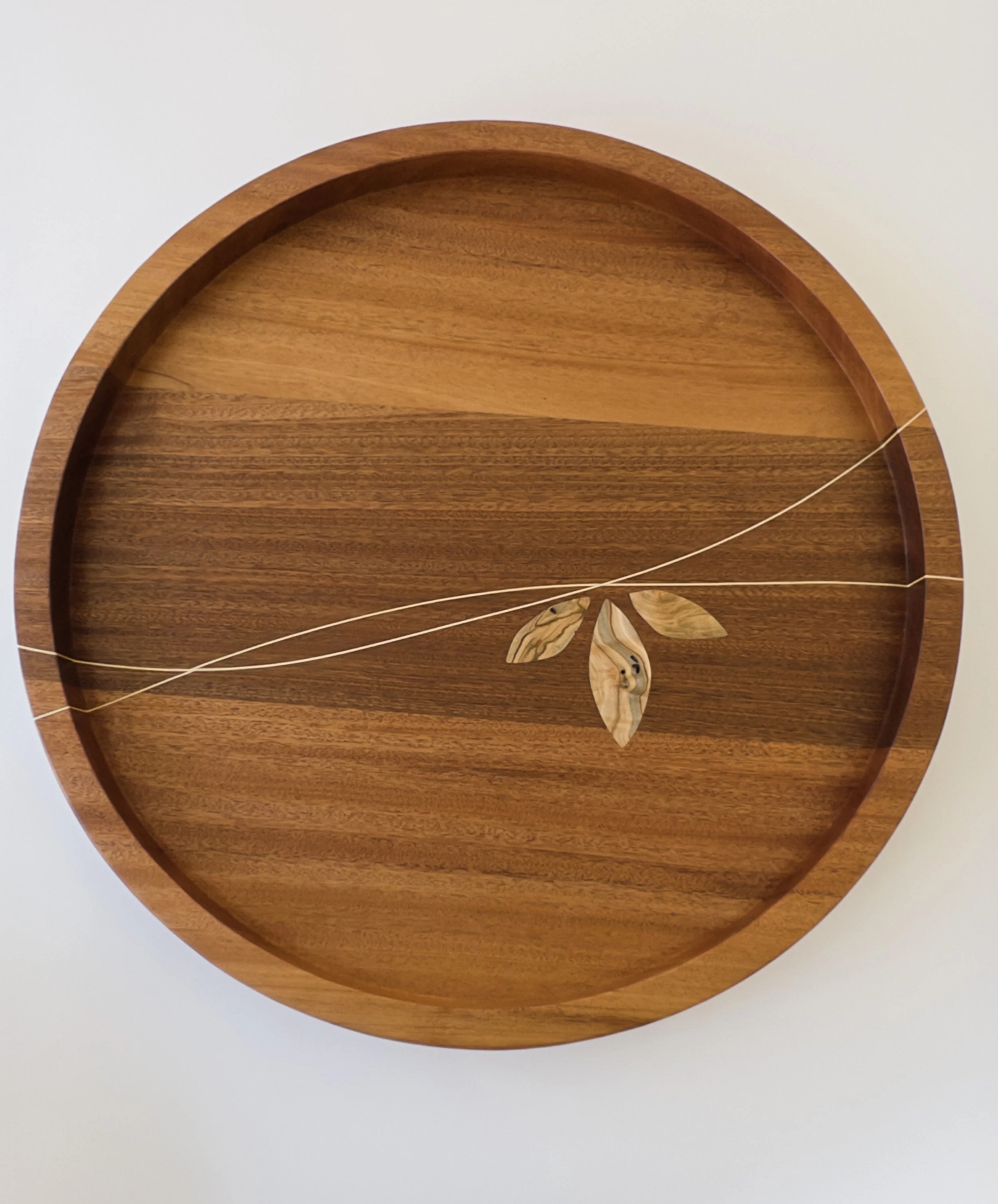 Large round dark wood tray with intricate maple inlay made by Toryn Black Design, fine woodworker in southern Appalachia