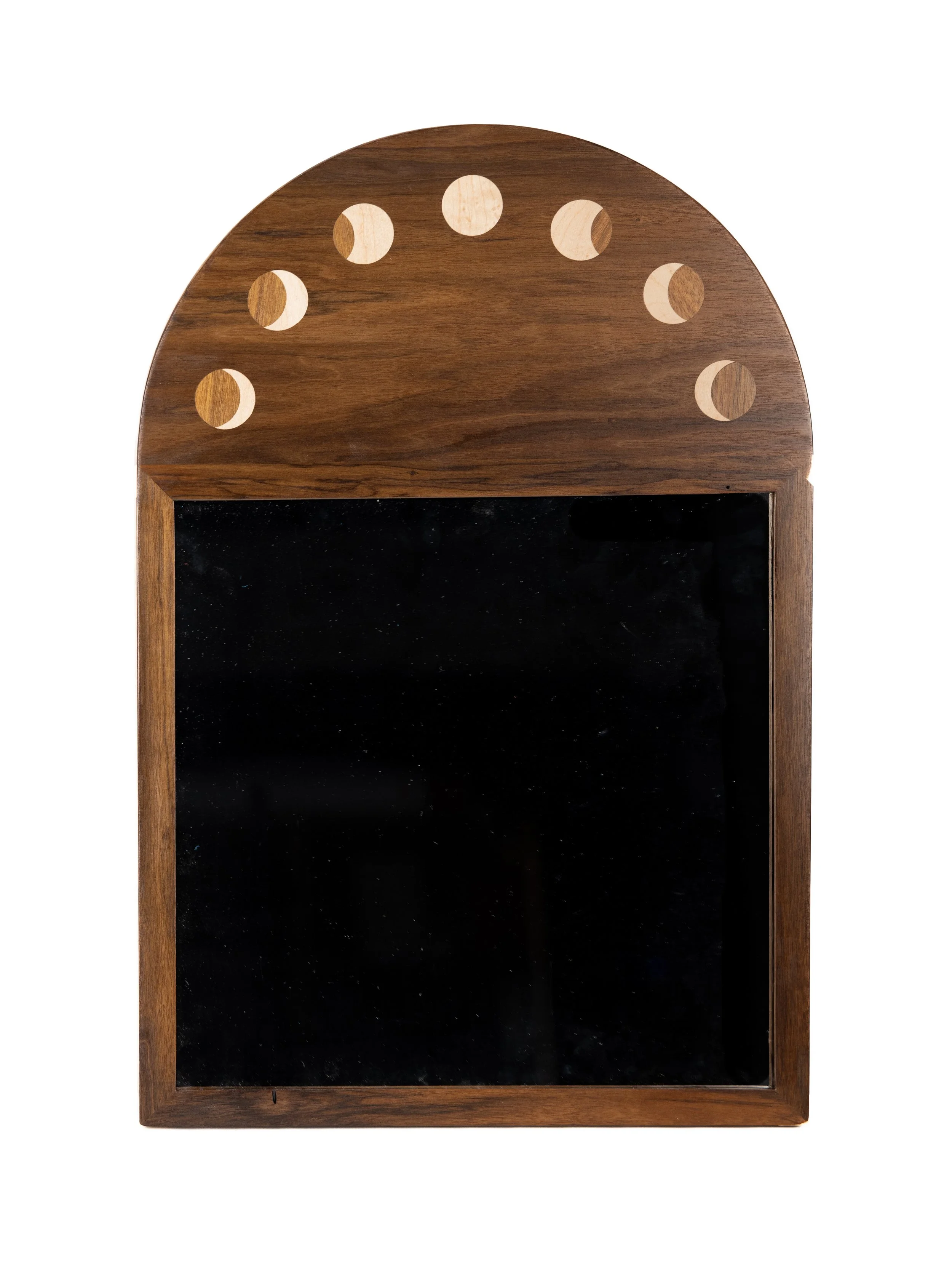 Wooden chalkboard with an arched top, featuring nine circular cutouts along the top edge.