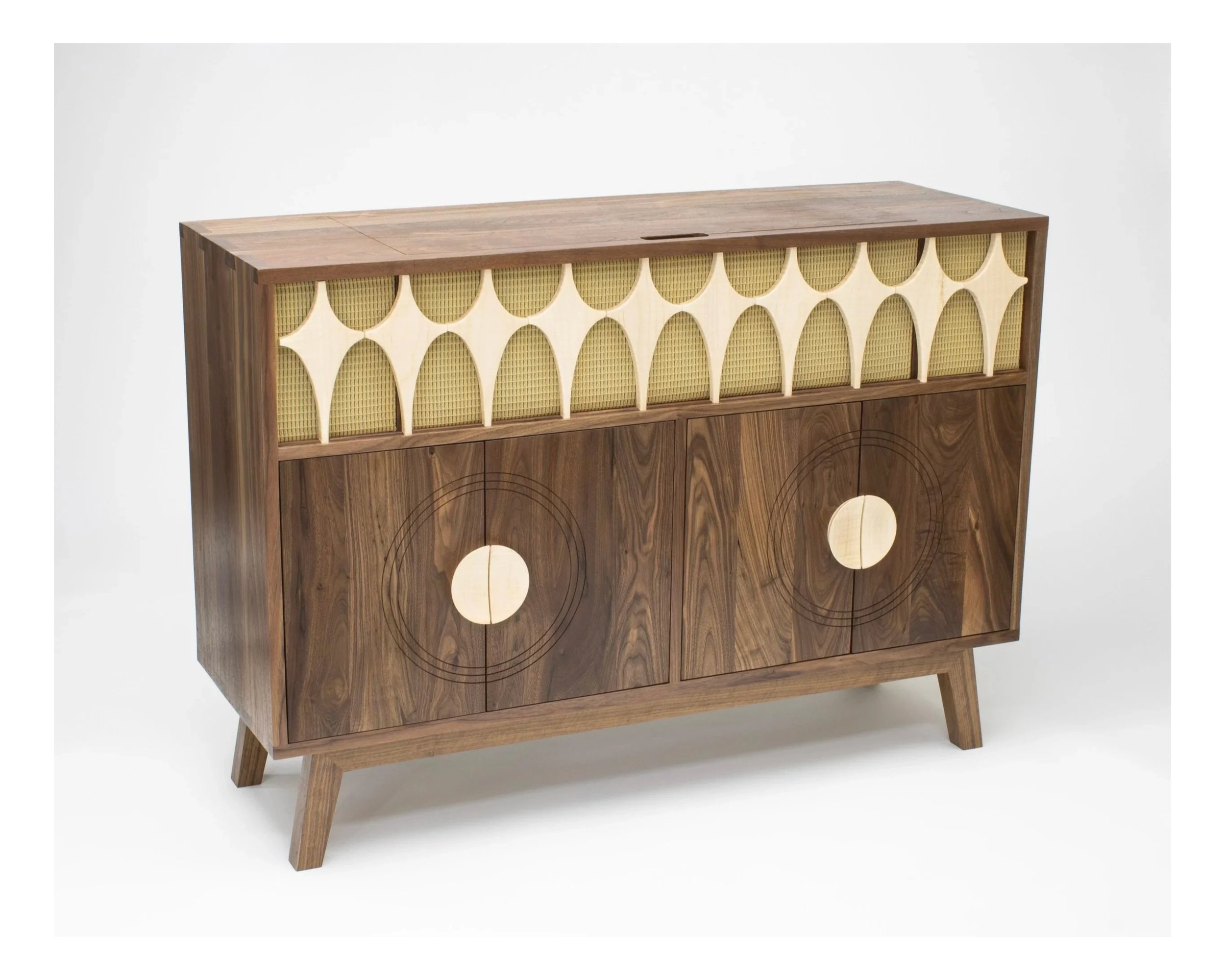 Mid-century modern Toryn Black Smith wooden sideboard with geometric design and circle motifs on the doors.