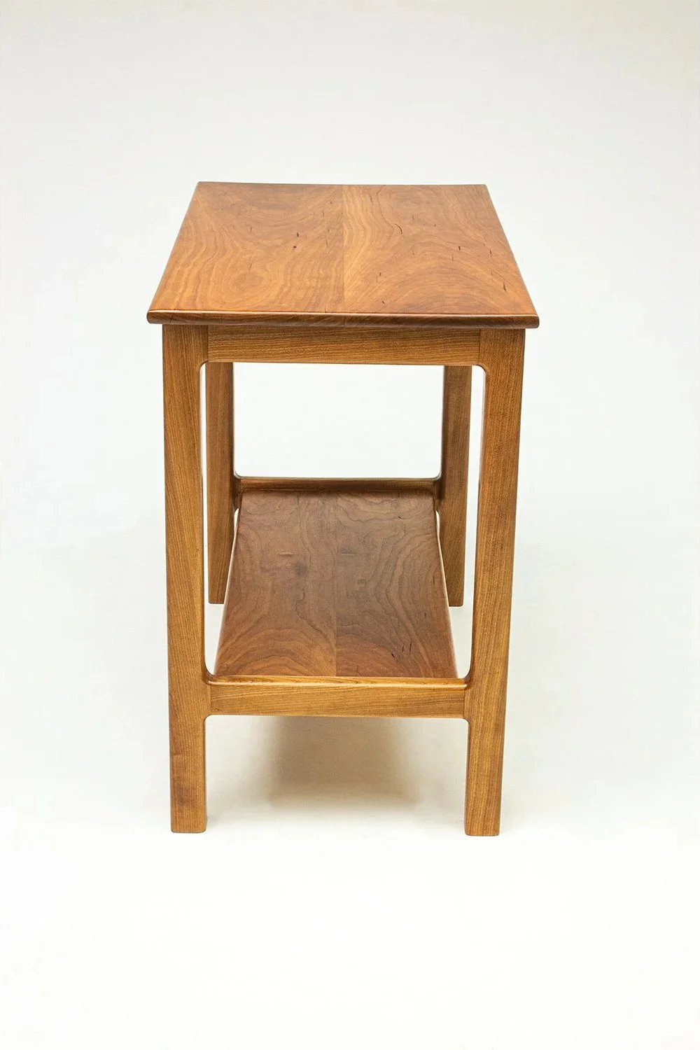 Handcrafted Cherry Charm side table by Toryn Black Design, made from Cherry, with blended joints. This contemporary fine-wood furniture piece combines traditional woodworking techniques and is handmade in Western North Carolina.