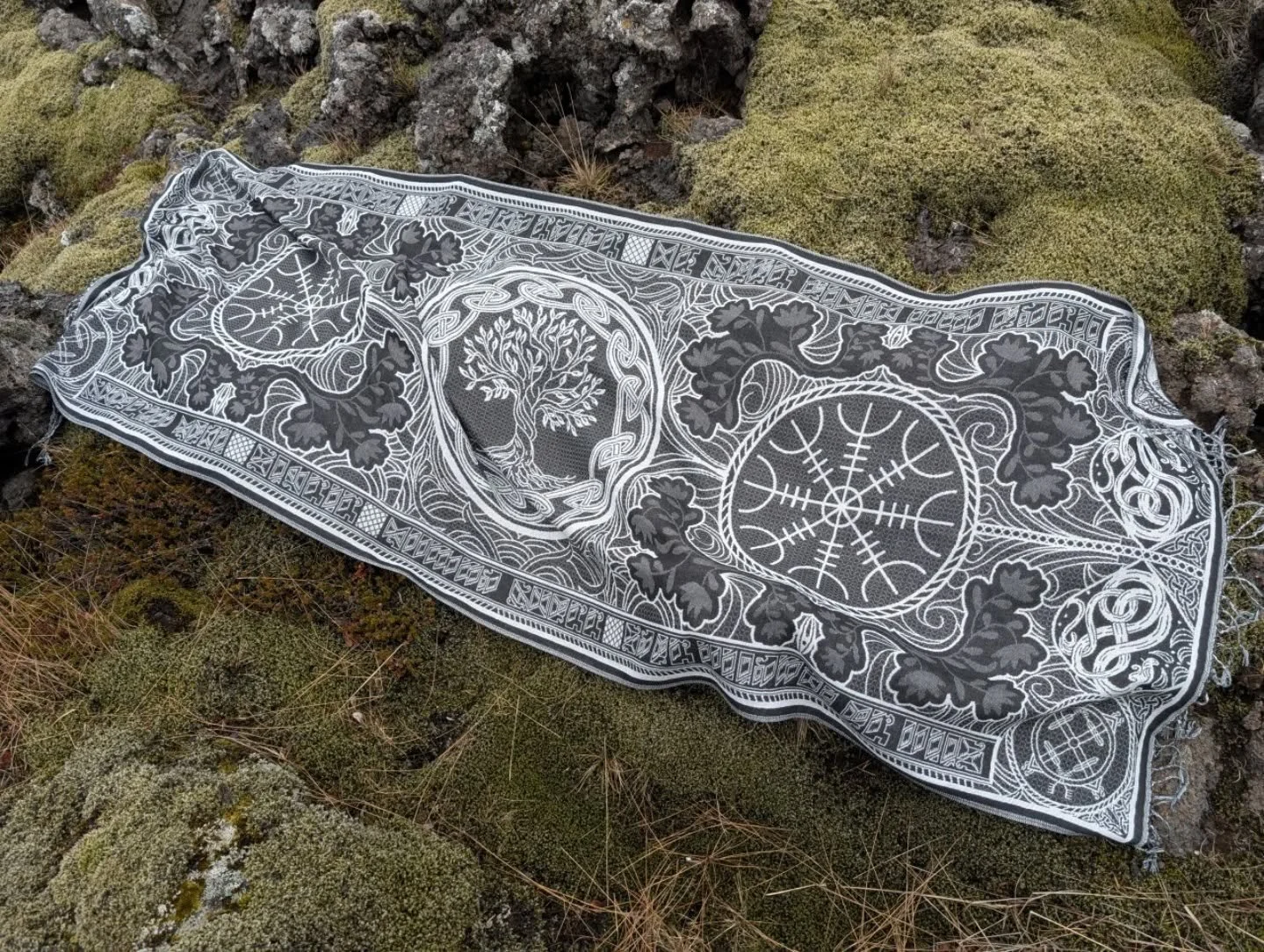 Wrap yourself in protection and power.

This pashmina weaves two ancient forces:
🌳 The Tree of Life &mdash; Yggdrasil, the axis of the Nine Worlds, keeper of connection, roots, and rebirth.
🛡 The Helm of Terror &mdash; a sigil of fearsome protectio