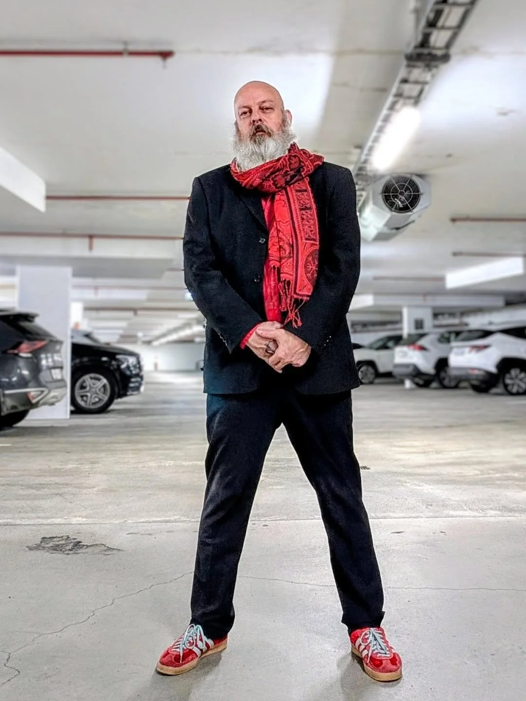 Somewhere between the shimmer of heat and the hum of the unseen, JG Eldey stands &mdash; the fire sorcerer wrapped in red and smoke, daring the ordinary to remember it was once extraordinary.

The Wanderer&rsquo;s Scarf was born from Icelandic nights