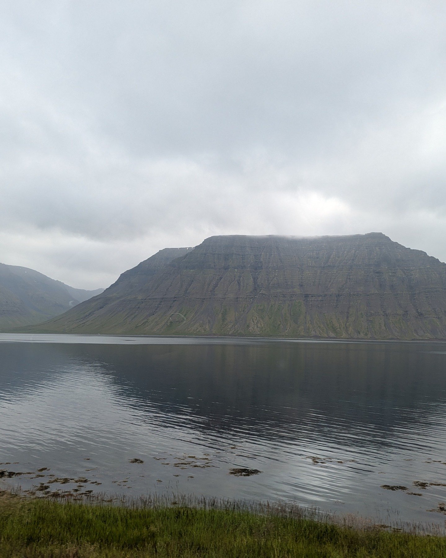 West Iceland doesn&rsquo;t announce itself.
It waits &mdash; in small towns like Flateyri, where the houses lean into the wind as if sharing secrets, and the past lingers politely, never quite leaving.

Later, the road carries us to Drangsnes, where 