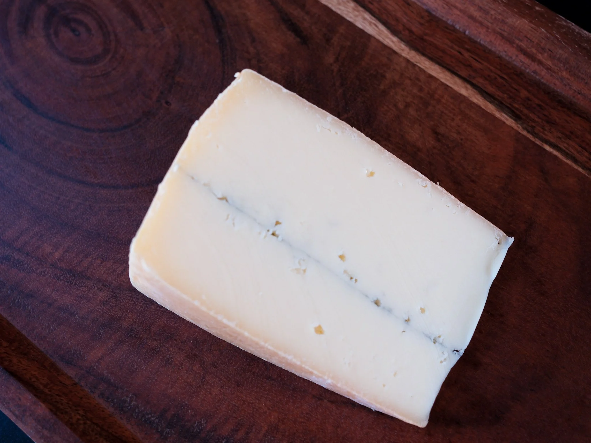 wedge of ashbrook cheese with a ash line down the center