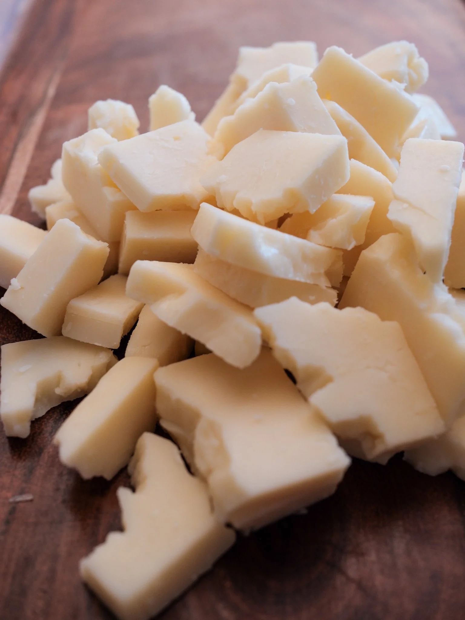 pieces of Apple Walnut Smoked cheddar by beehive cheese company.