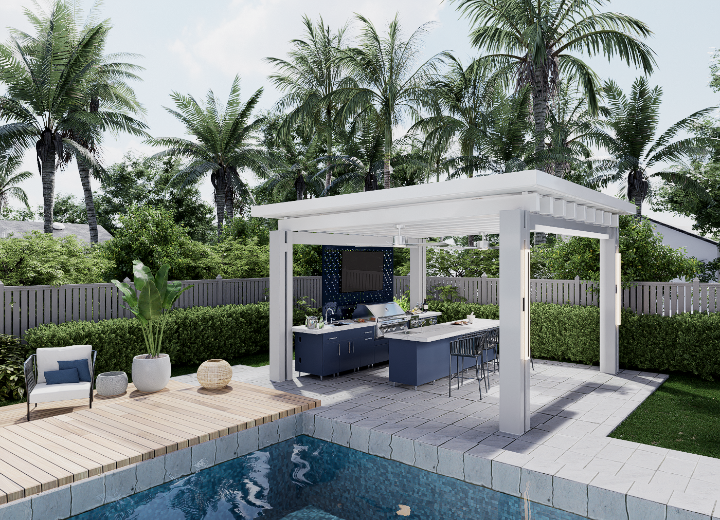 An outdoor backyard with a swimming pool, wooden deck, and a covered outdoor kitchen area with a grill and a counter with bar stools, surrounded by lush green trees and shrubs.