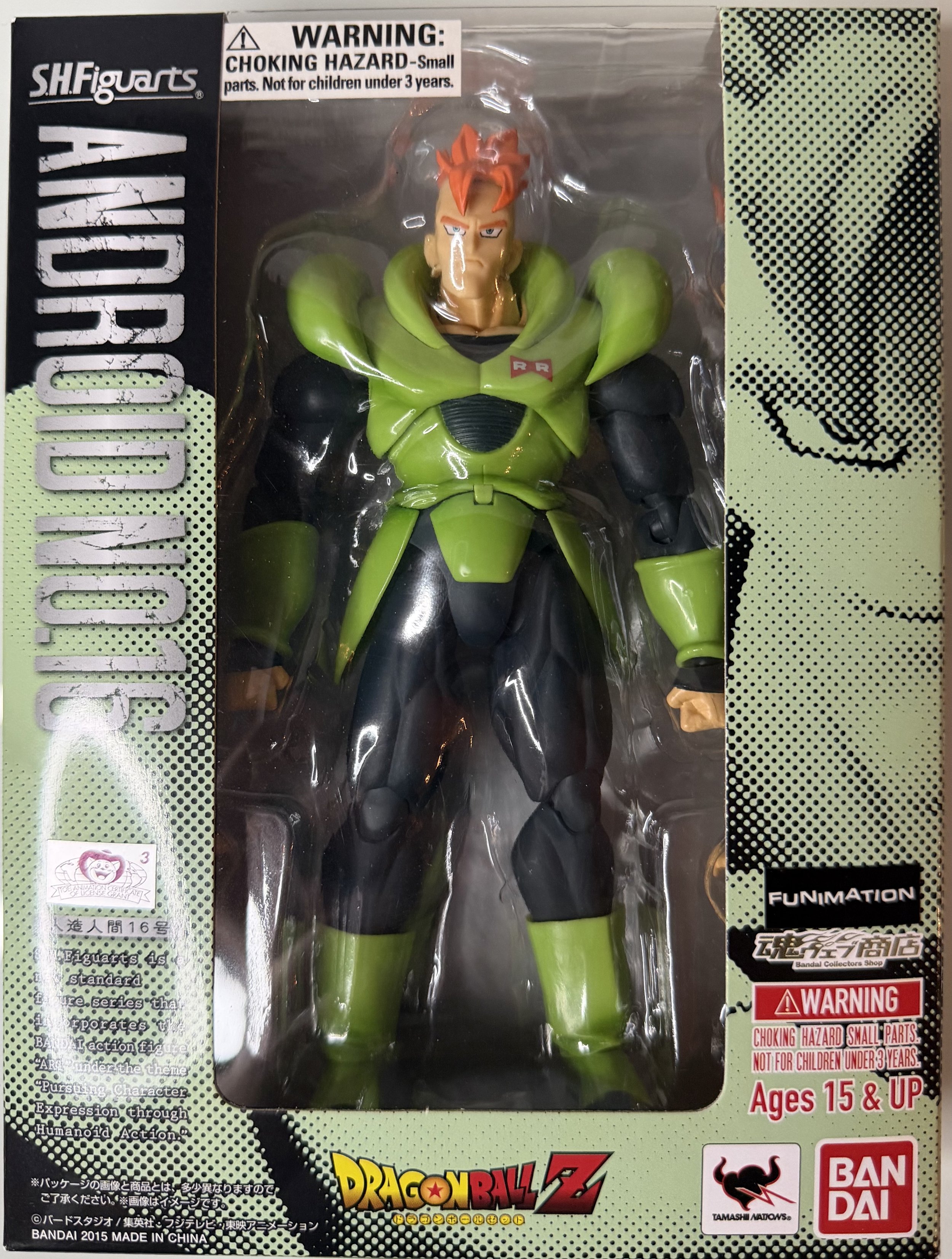 Action figure of Android 16 from Dragon Ball Z in packaging, with green and black armor, spiky orange hair, and stern expression.