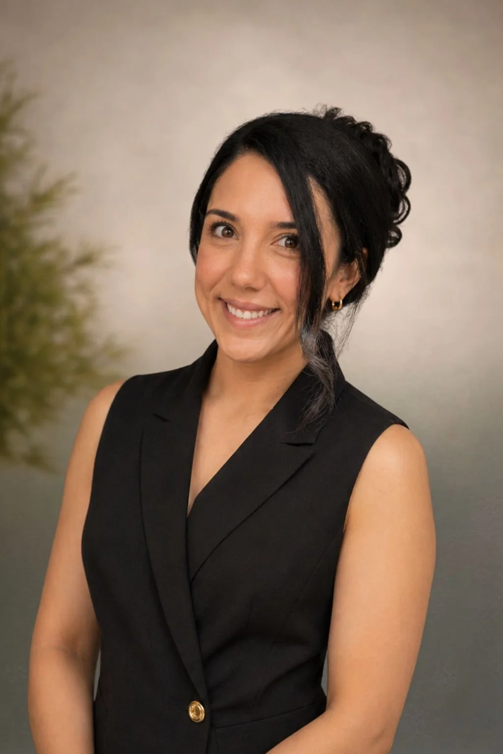 Jess, co-founder of Velvet and Lace Events, smiling in a black vest