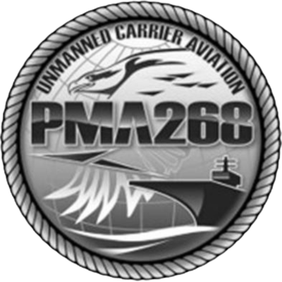A circular emblem with the text 'Unmanned Carrier Aviation.' It features a stylized jet and a ship, with the designation 'PMA 268' in the center.