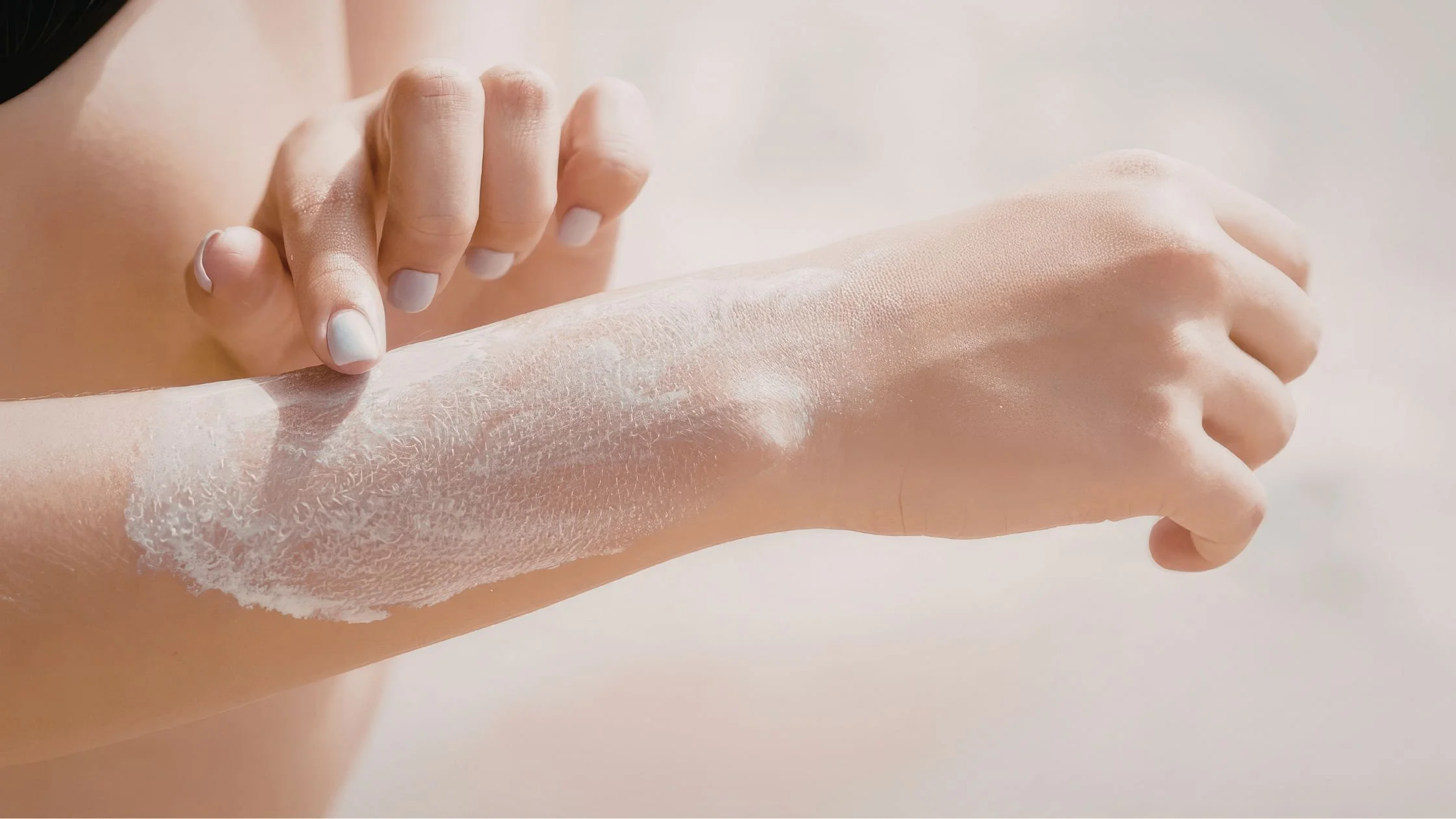 Applying soothing lotion after waxing to hydrate and calm sensitive skin