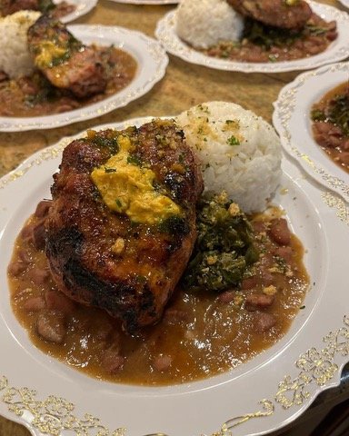 Pork Ribeye with Cajun Butter, Red Beans & Rice, Braised Kale & Collards