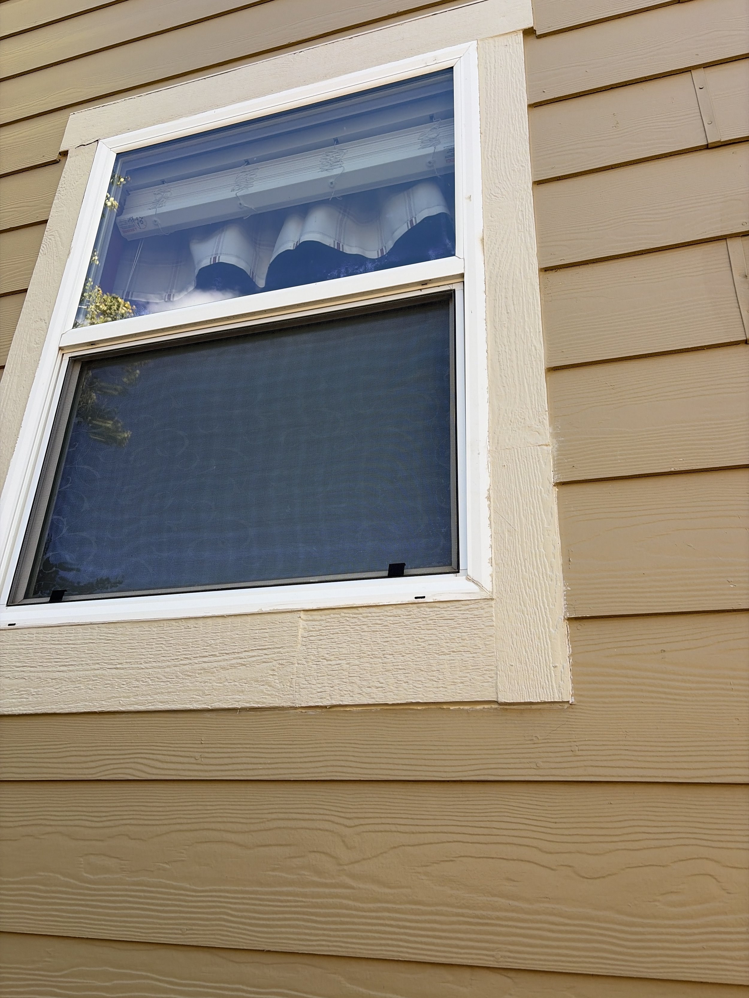 New wood window trim, sealed, caulked and painted to match the existing trim after rot repair.