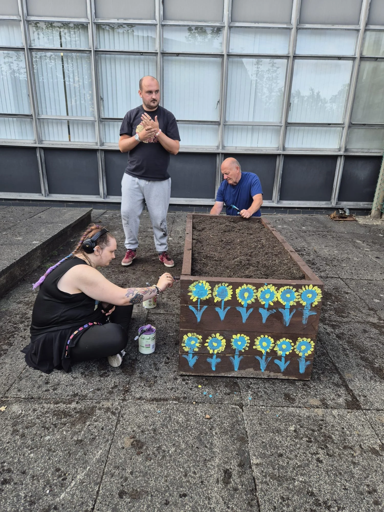 Participants decorating the planters in our social prescribing sessions