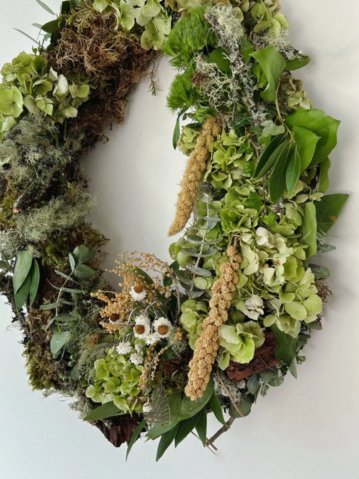 Margo said this wreath is her “walk into the forest.”
Last year I built the base from scratch, a minimal frame to let simplicity speak (swipe to see).
This year, we're leaning lush... the world's been feeling ugly, and we can't quite ge