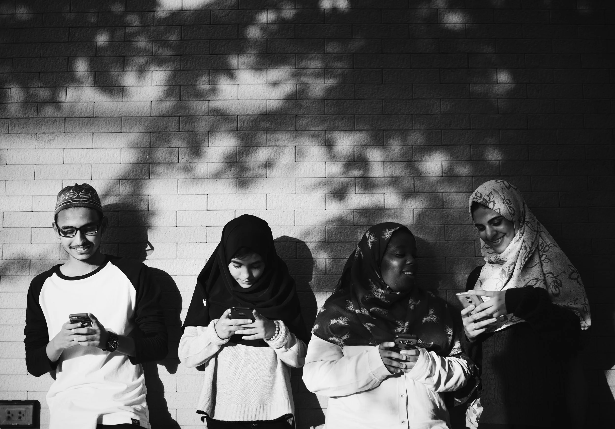 group-muslim-students-using-mobile-phones.jpg
