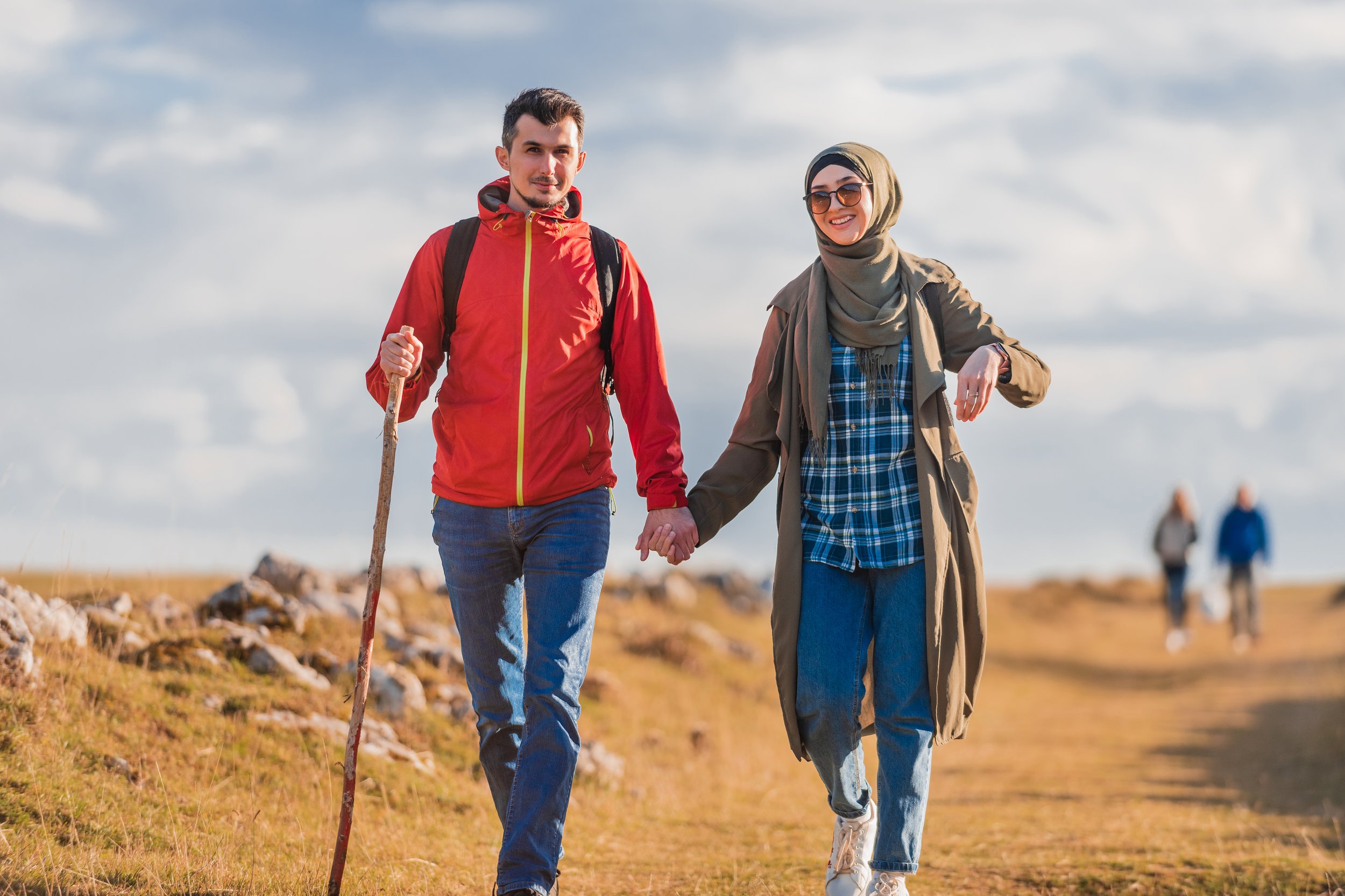 young-happy-muslim-couple-trail-hiking-mountain-they-are-walking-together-with-holding-hands.jpg