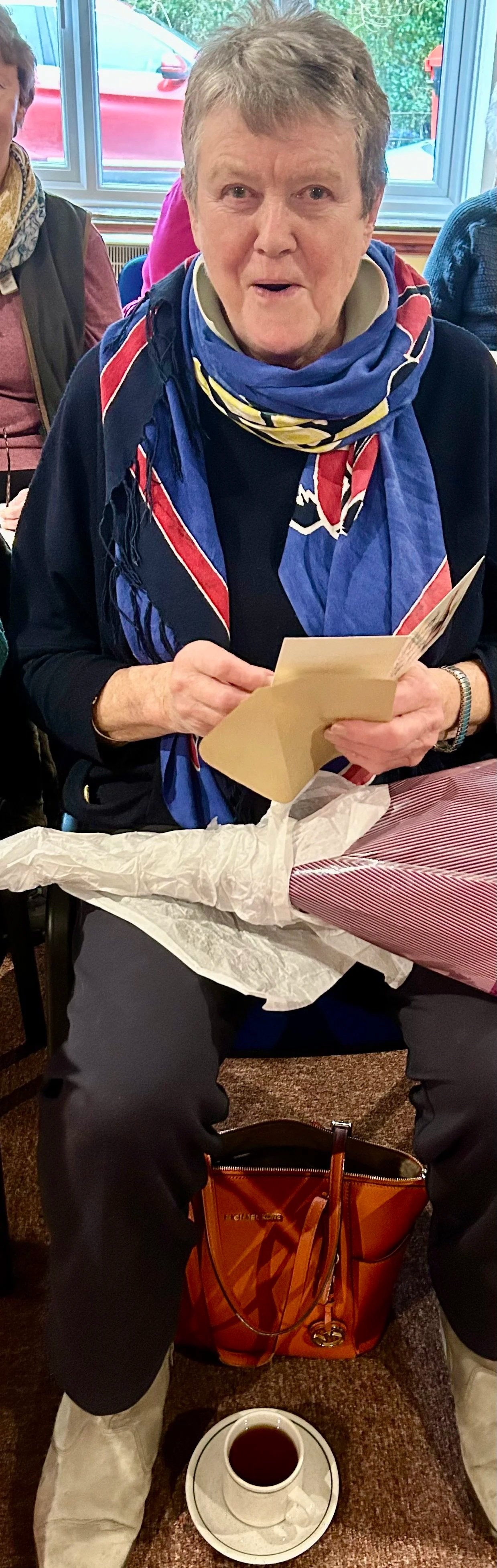 Ann Levick receiving birthday flowers from the Ladies circle - February 2026.