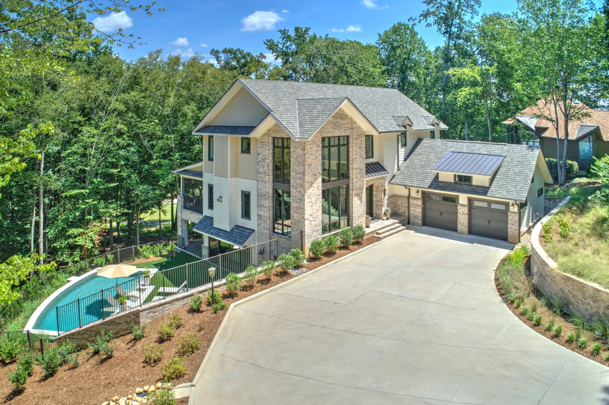 Modern French Country front yard aerial view