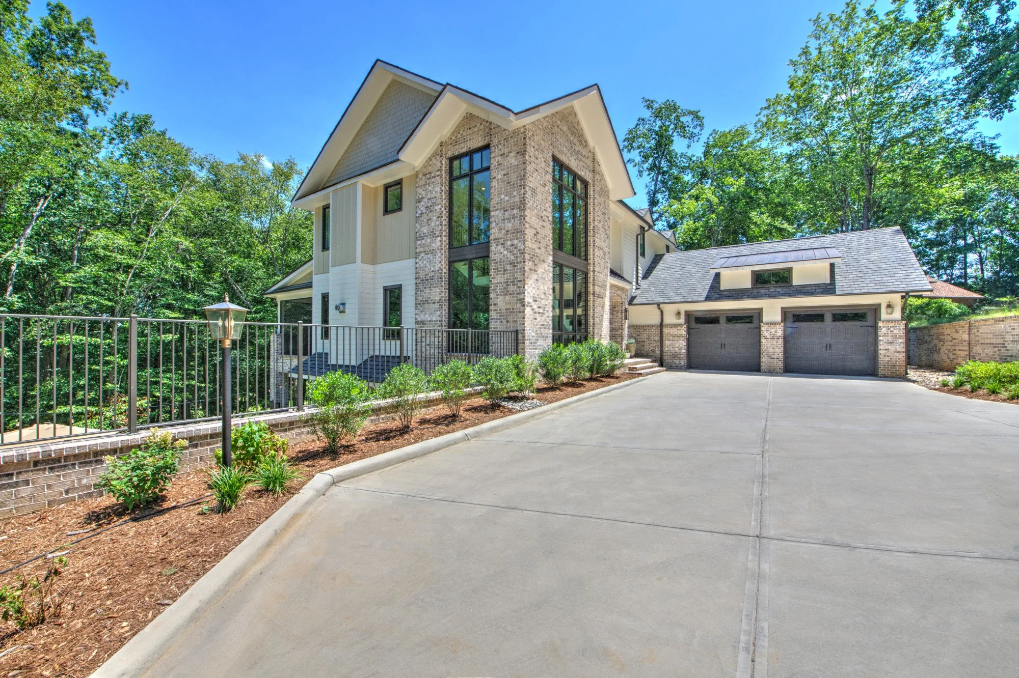 Modern French Country front, garage, and driveway