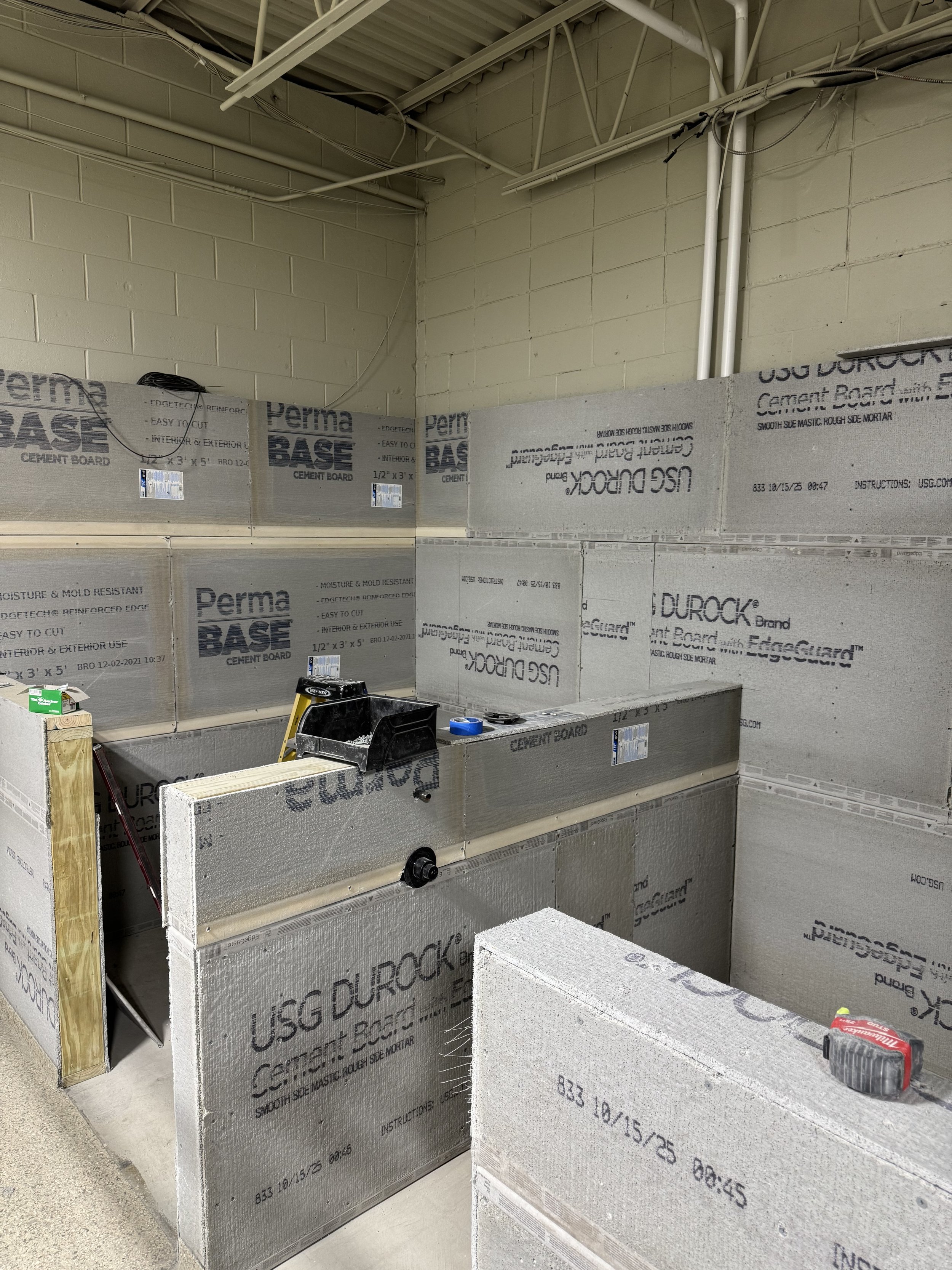 Side by side bathing areas. Tiling coming soon!