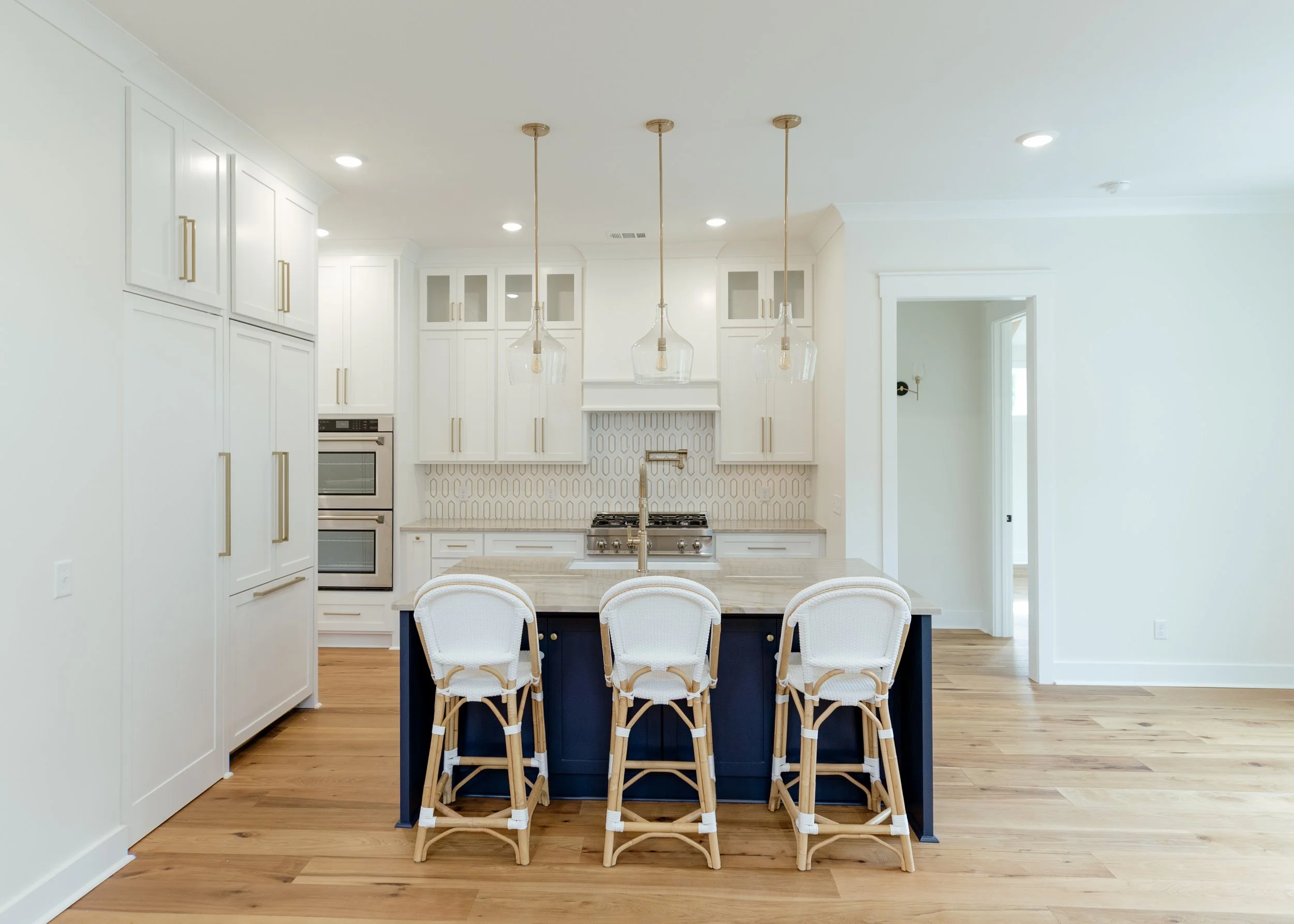 two tone kitchen cabinet with white cabinets and a deep blue island