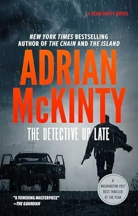Book cover for Adrian McKinty's novel "The Detective Up Late" featuring a silhouette of a man walking with an umbrella in the rain, with a dark sky, a vintage car, and a church steeple in the background.