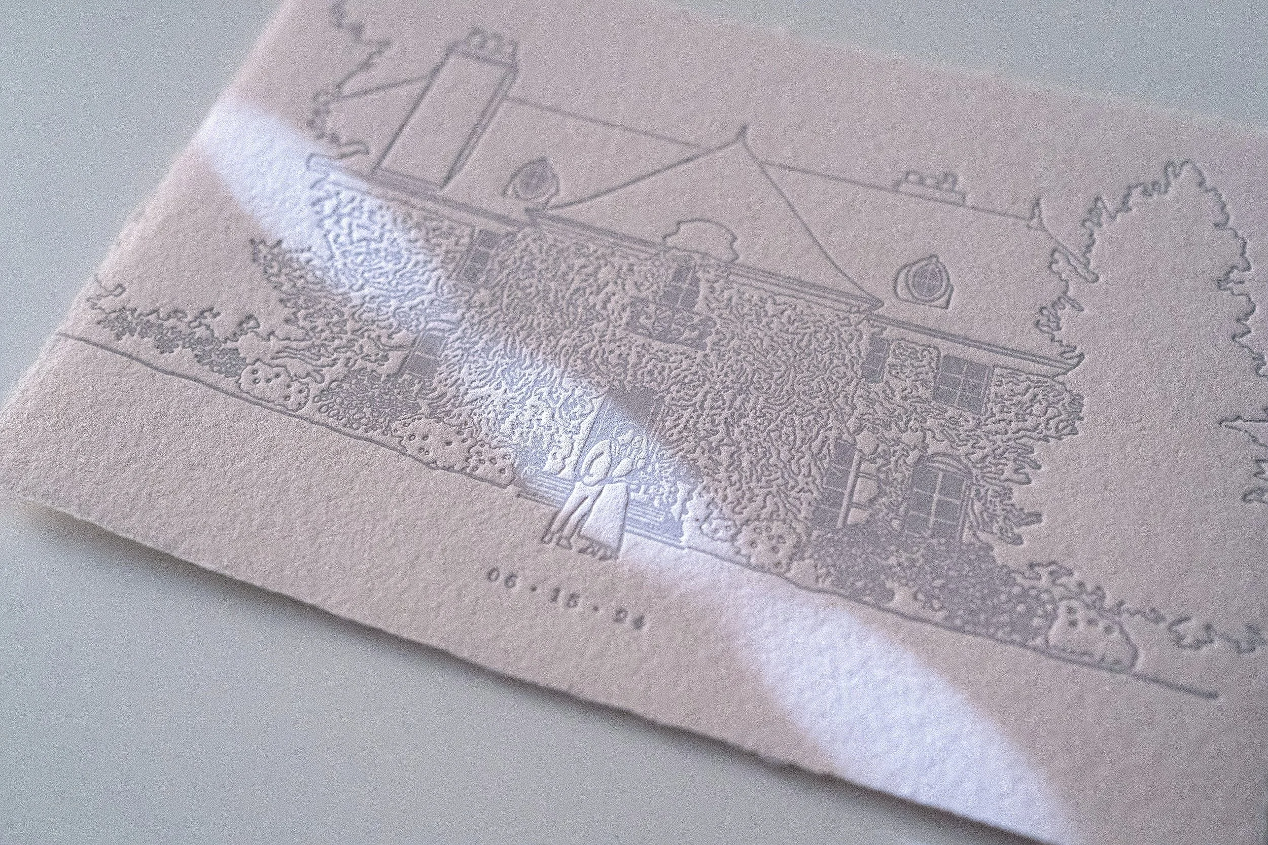 Close-up of a custom venue illustration printed in letterpress on handmade cotton paper