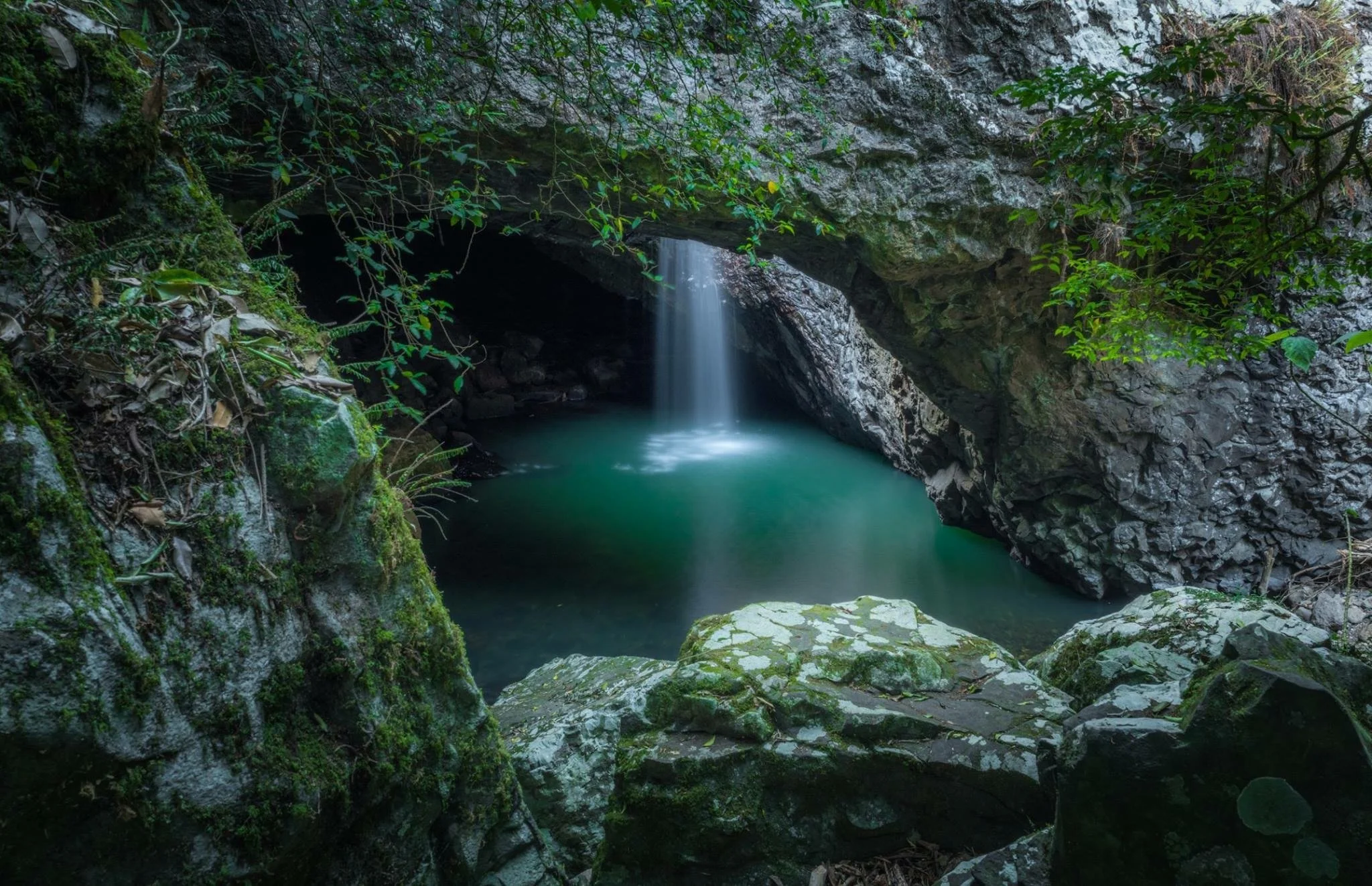 Outside, looking in at the Natural Bridge's waterfall