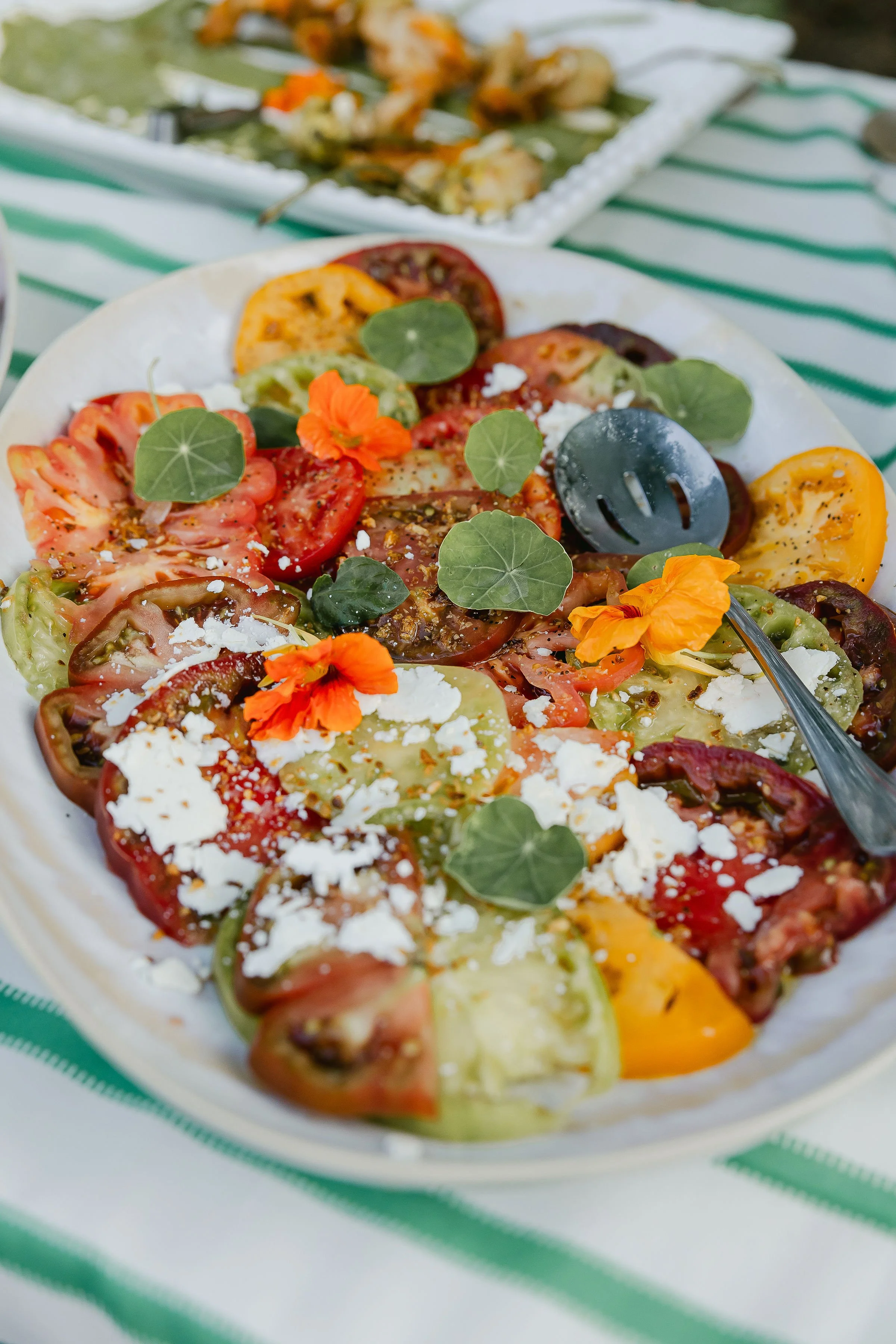 Heirloom Tomatoes, Nasturtium, Ricotta Salata, Fried Garlic