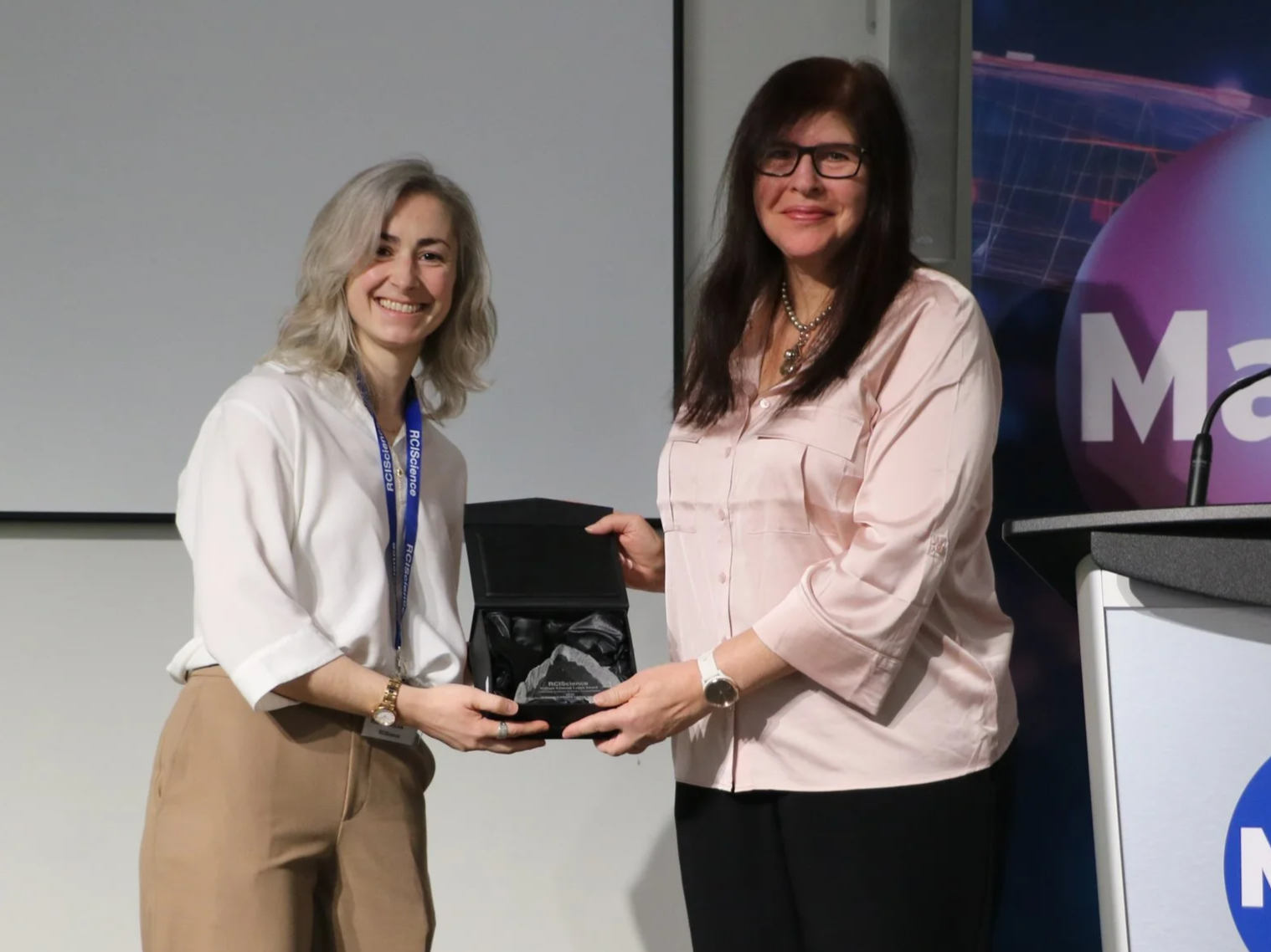 Carrie Boyce (RCIScience) presents CCRM with the 2025 Logan Award.png