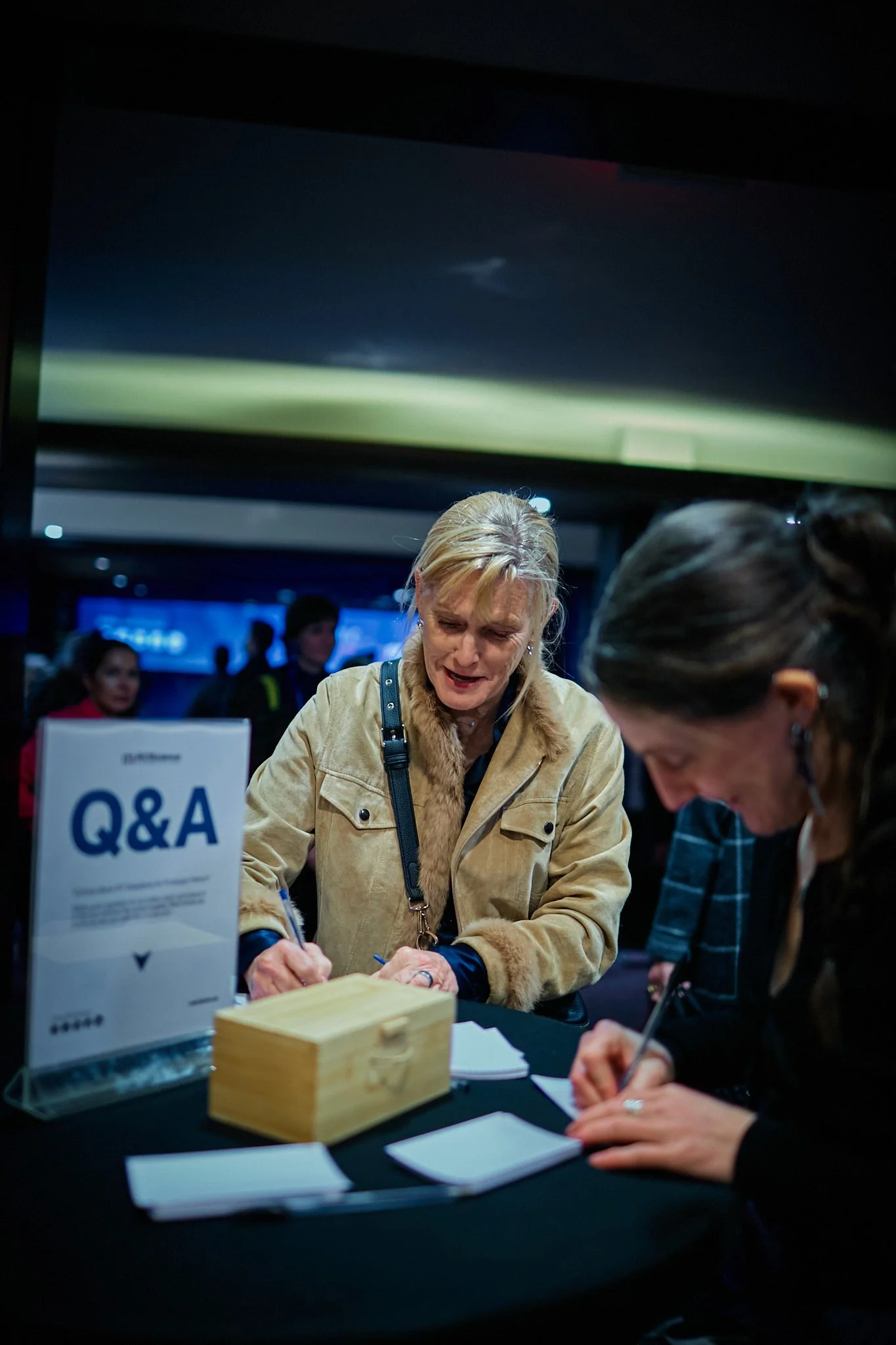 Two people submitting questions about Artificial Intelligence for the Q&amp;A session with Prof. Geoffrey Hinton
