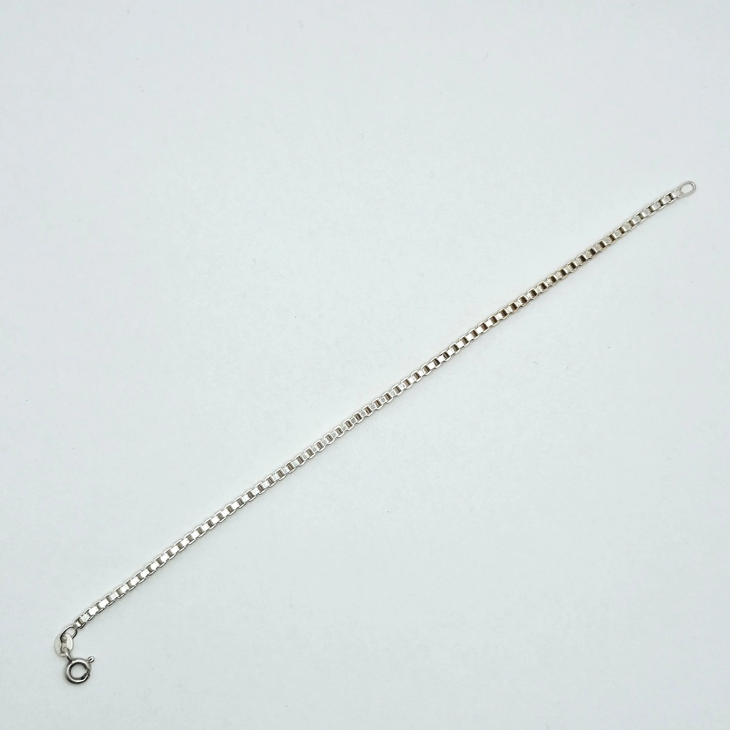 Minimalist sterling silver bracelet with square box chain design, sleek and modern