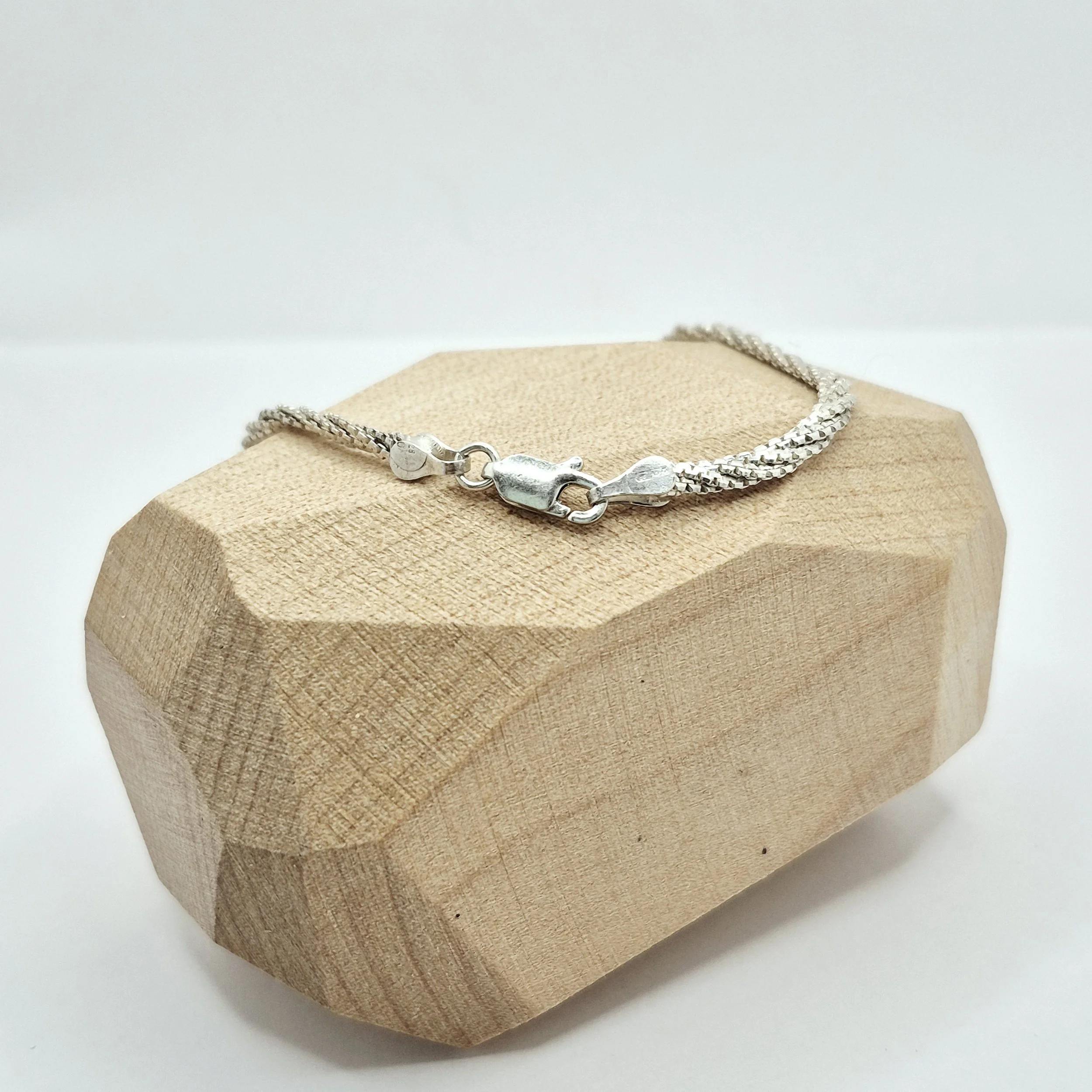 1️⃣ Smooth serpentine-style sterling silver bracelet with soft texture, 7 inch