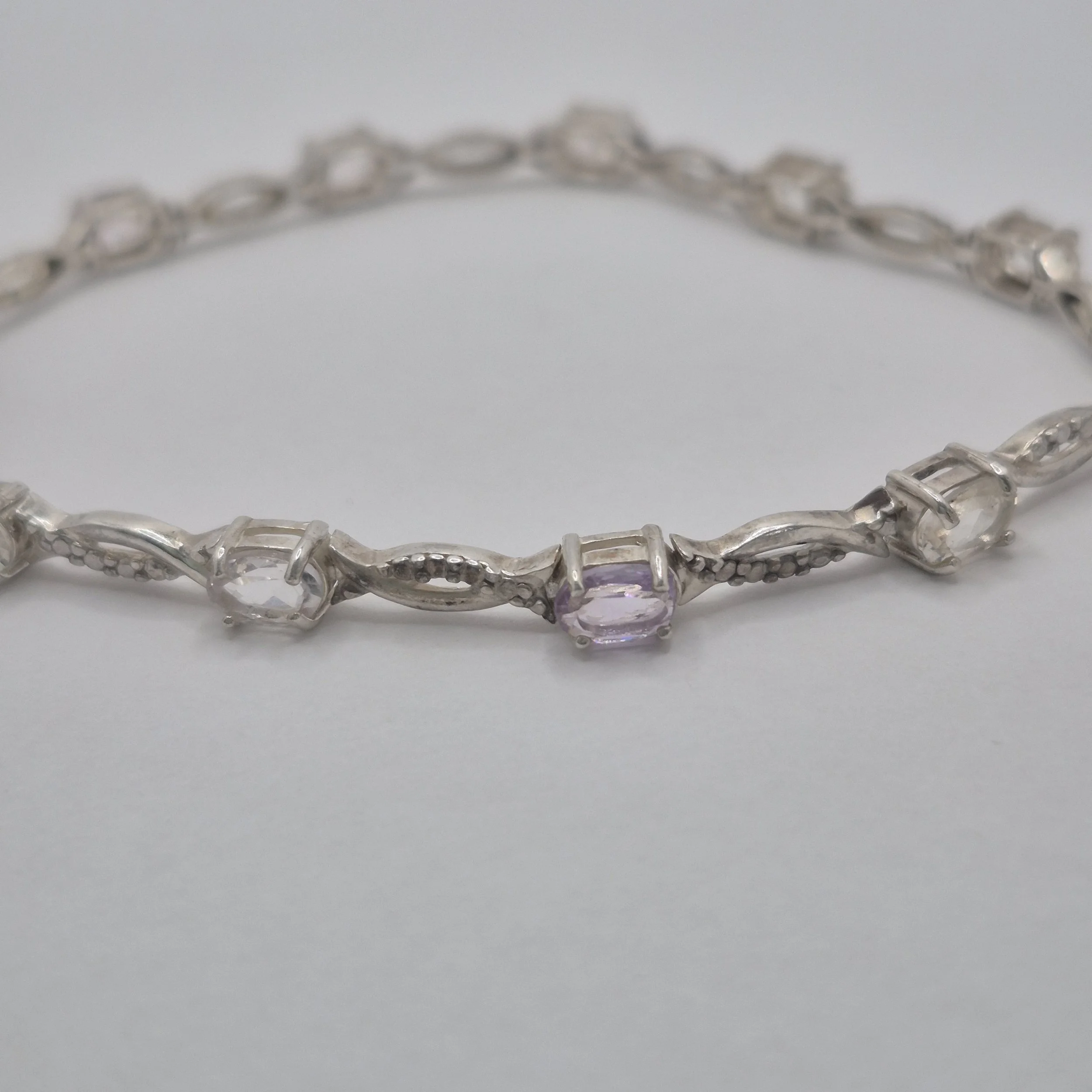 Sterling silver bracelet with color-shifting white to lavender stones – 7.5 inch Aura design